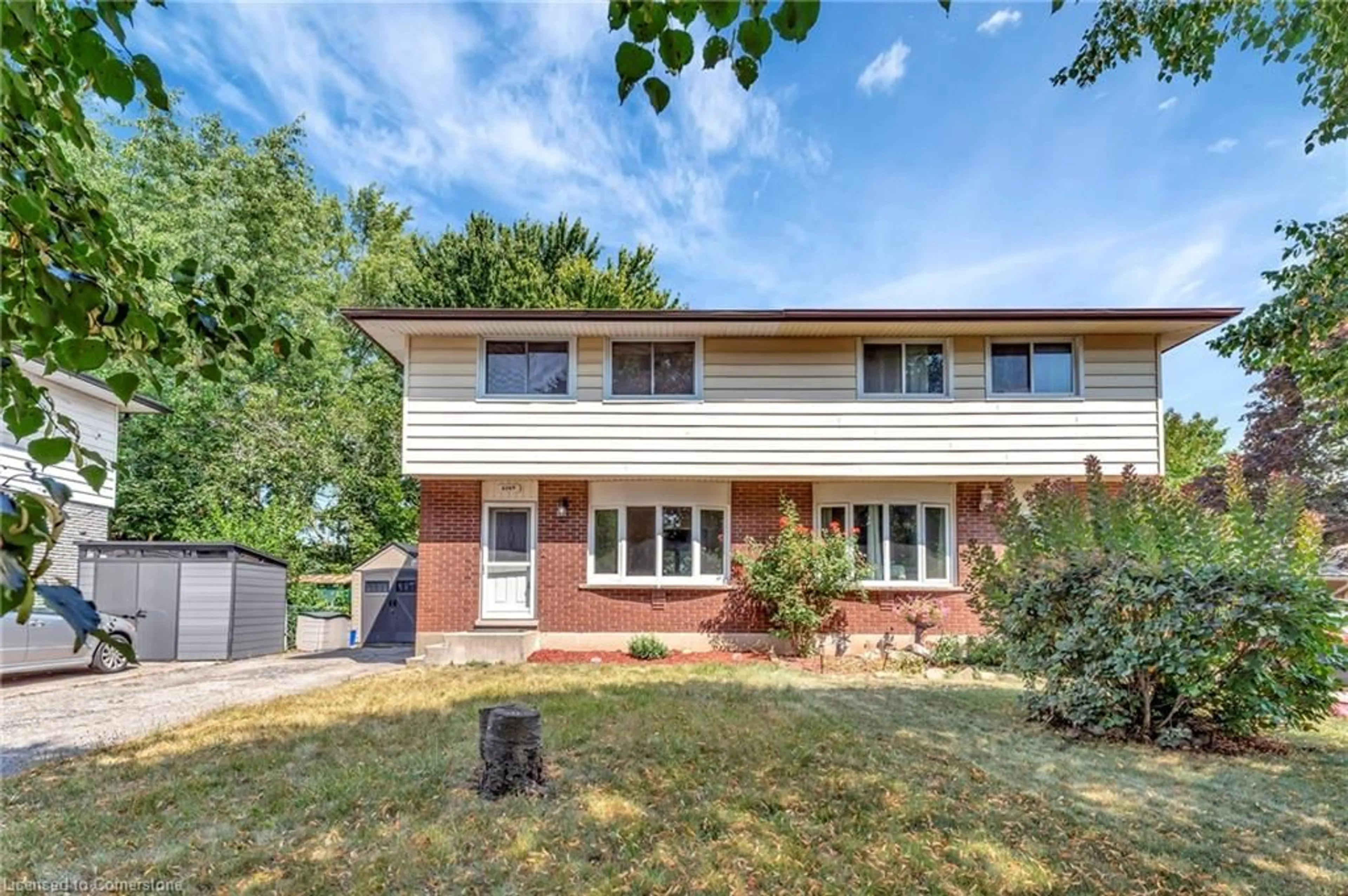 Home with brick exterior material, street for 604 Mount Anne Dr #B, Waterloo Ontario N2L 4W3