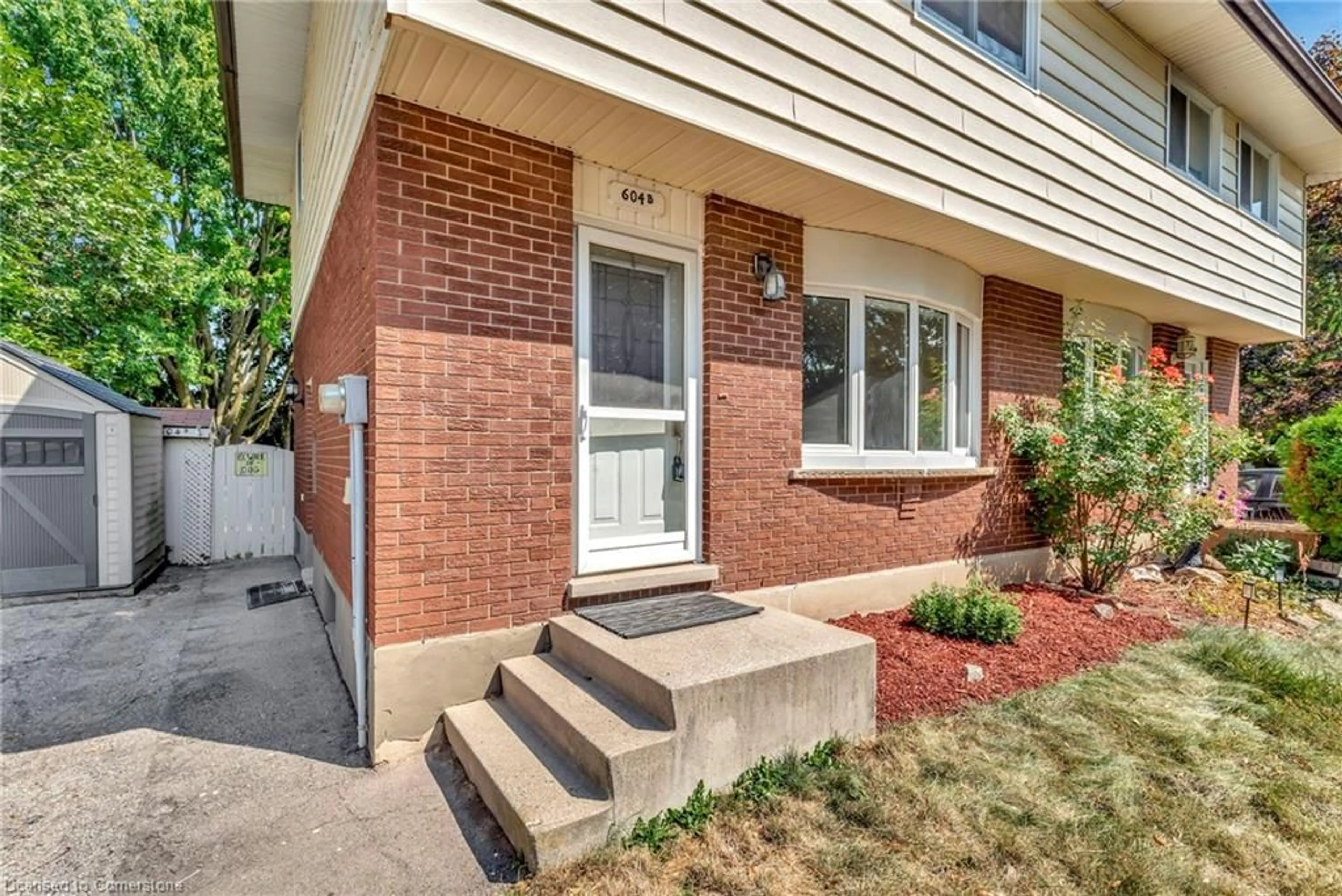 Home with brick exterior material, street for 604 Mount Anne Dr #B, Waterloo Ontario N2L 4W3