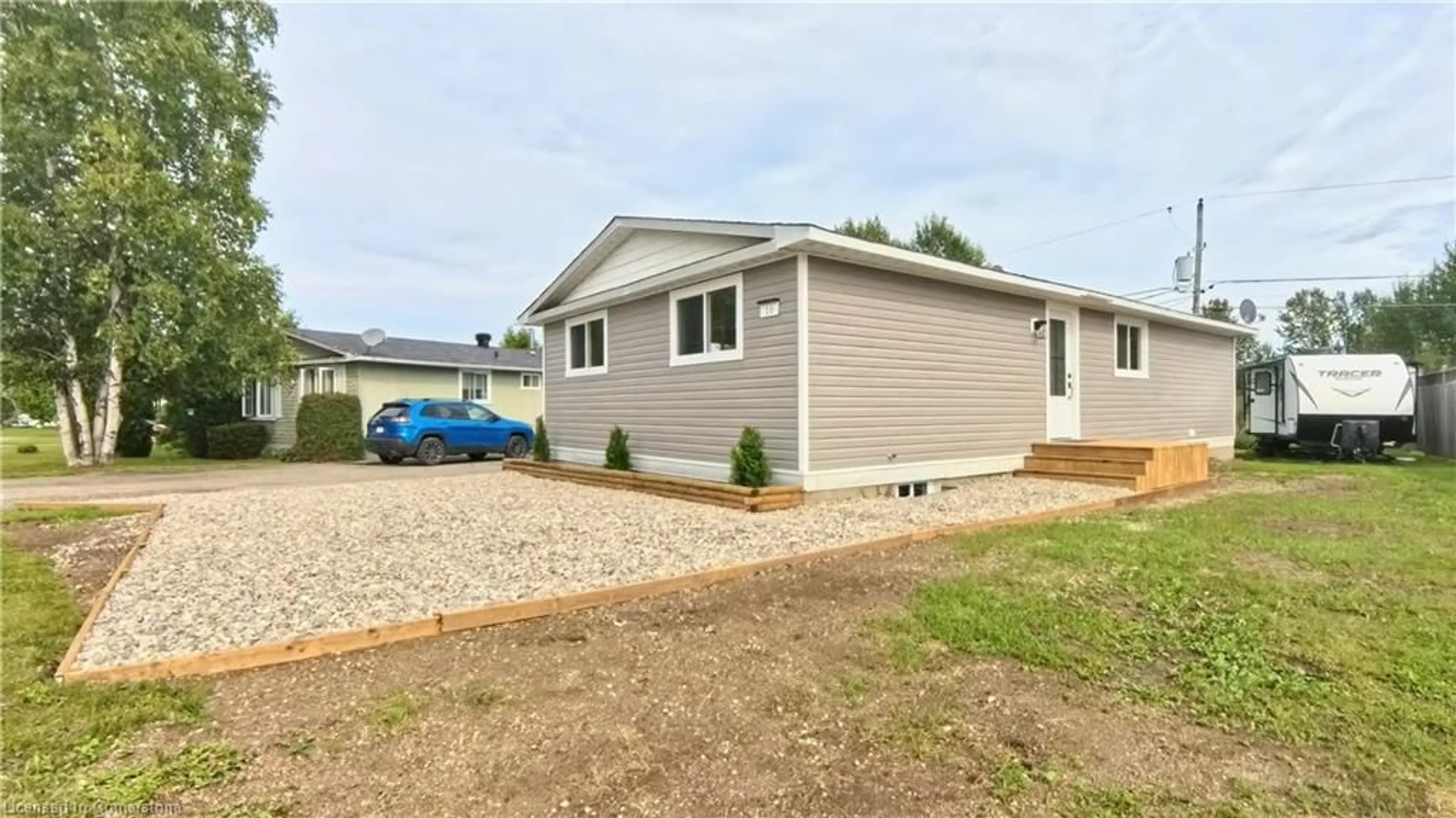 Home with vinyl exterior material, street for 16 Robin Ave, Manitouwadge Ontario P0T 2C0