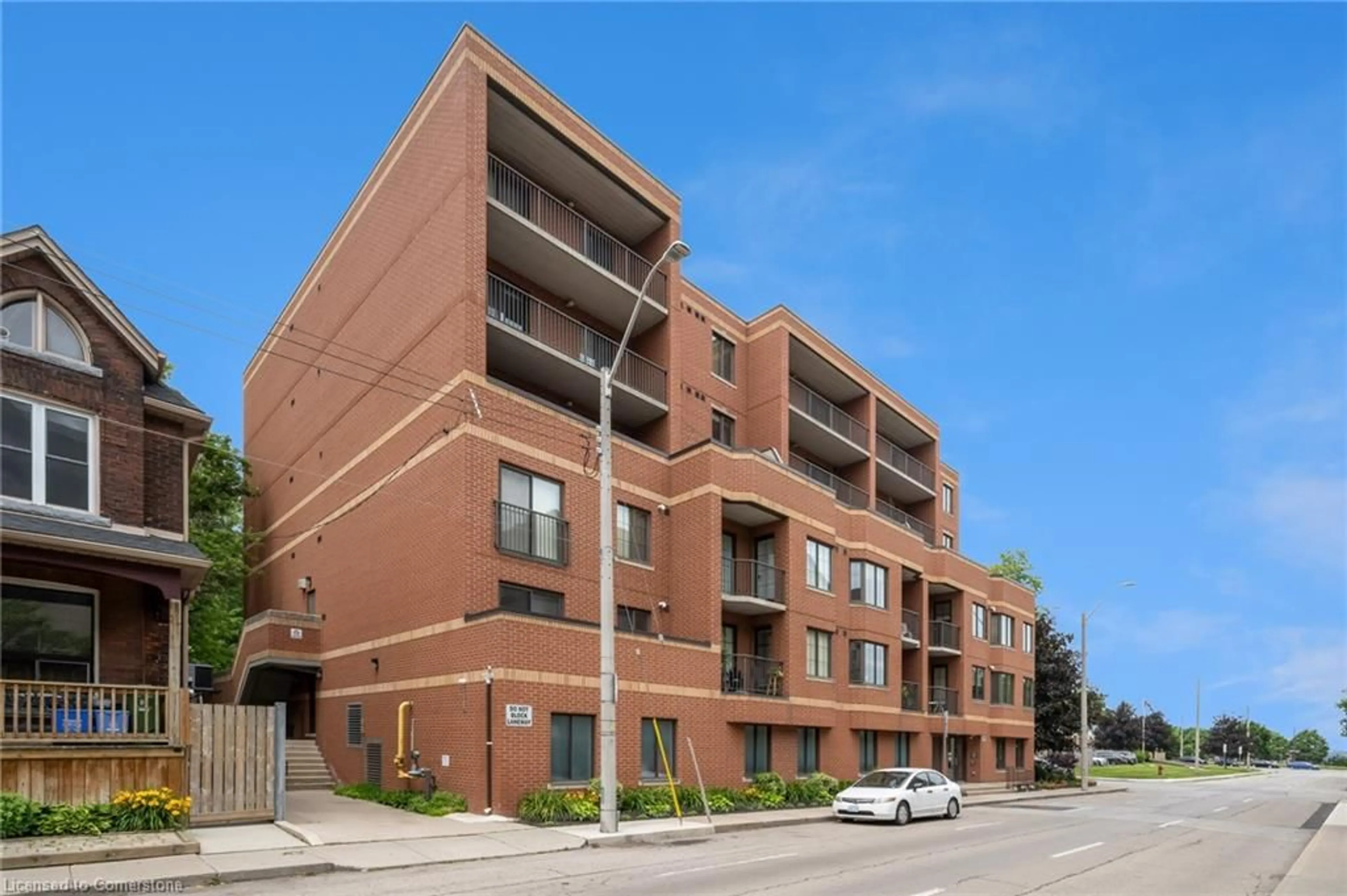 Home with brick exterior material, street for 47 Caroline St #209, Hamilton Ontario L8R 2R6