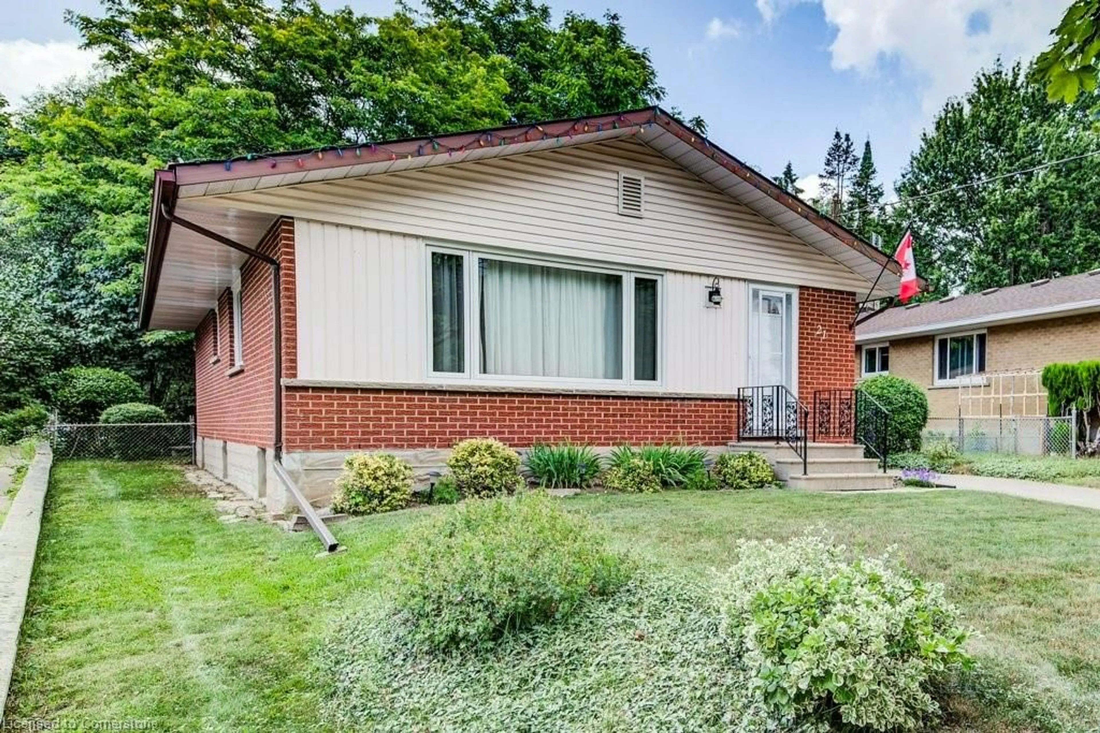 Home with brick exterior material, street for 21 Ruskview Rd, Kitchener Ontario N2M 4S1