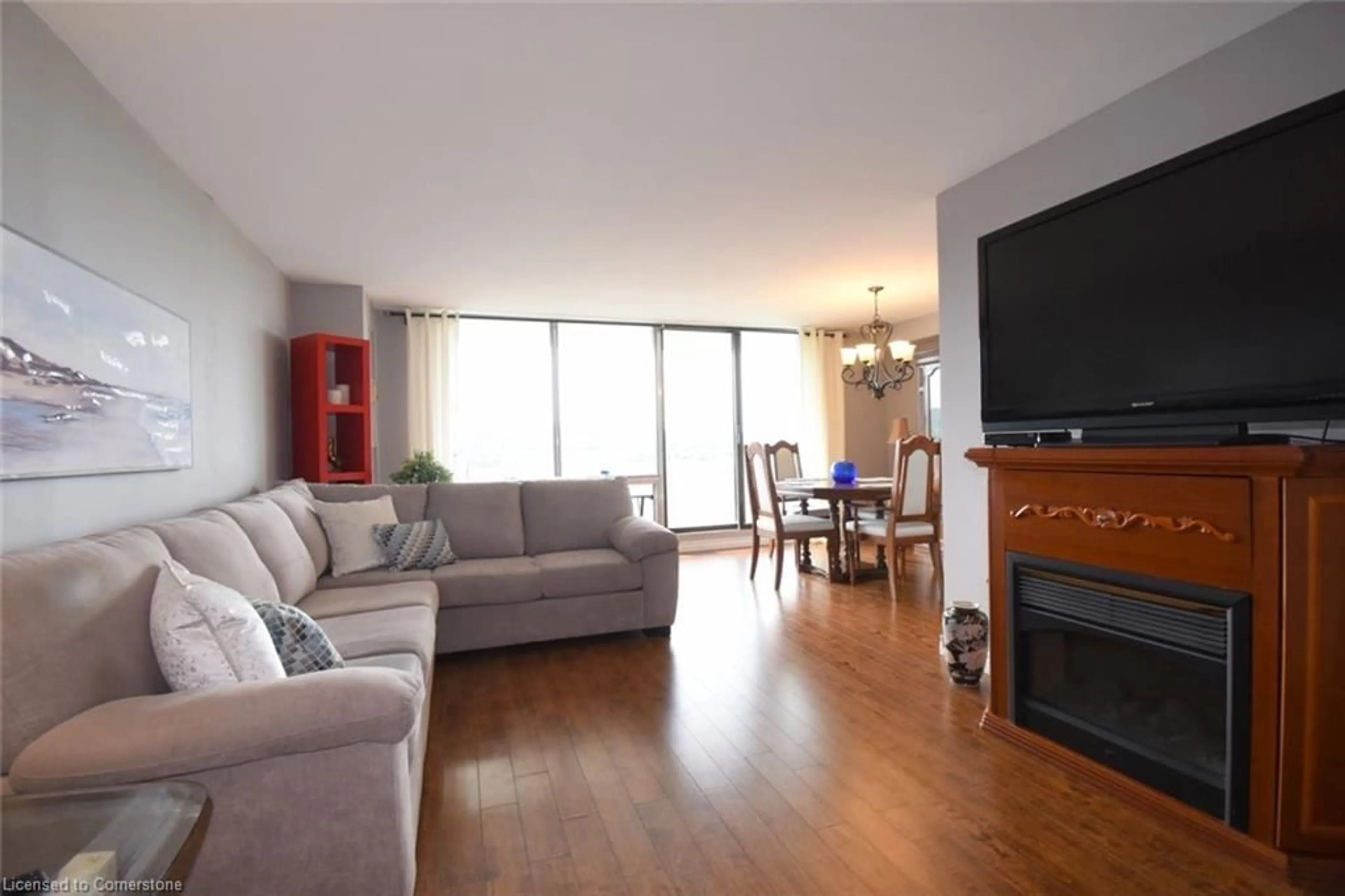 Living room with furniture, wood/laminate floor for 2055 Upper Middle Rd #1610, Burlington Ontario L7P 3P4