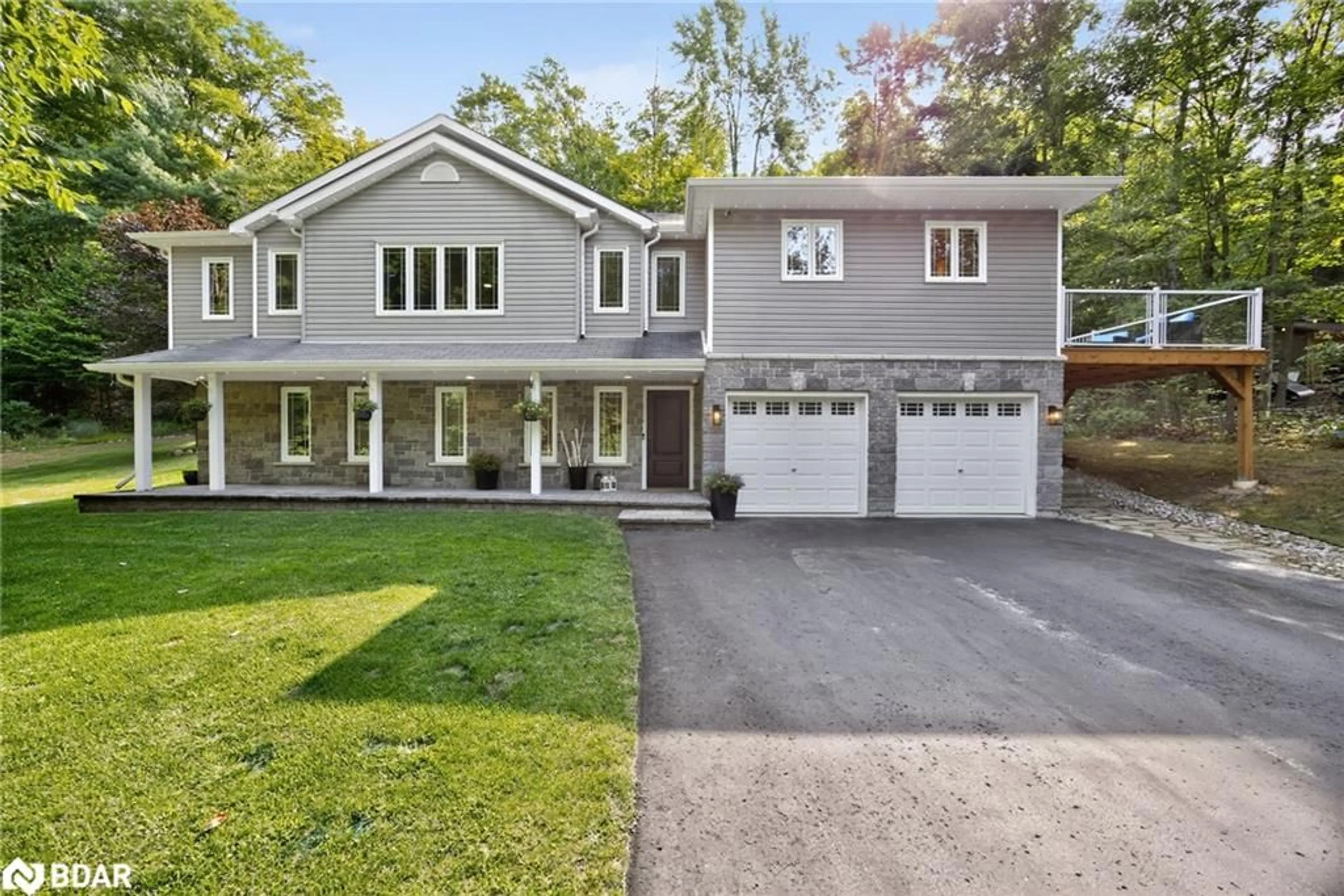 Home with vinyl exterior material, street for 135 Huron Woods Drive Dr, Coldwater Ontario L0K 1E0
