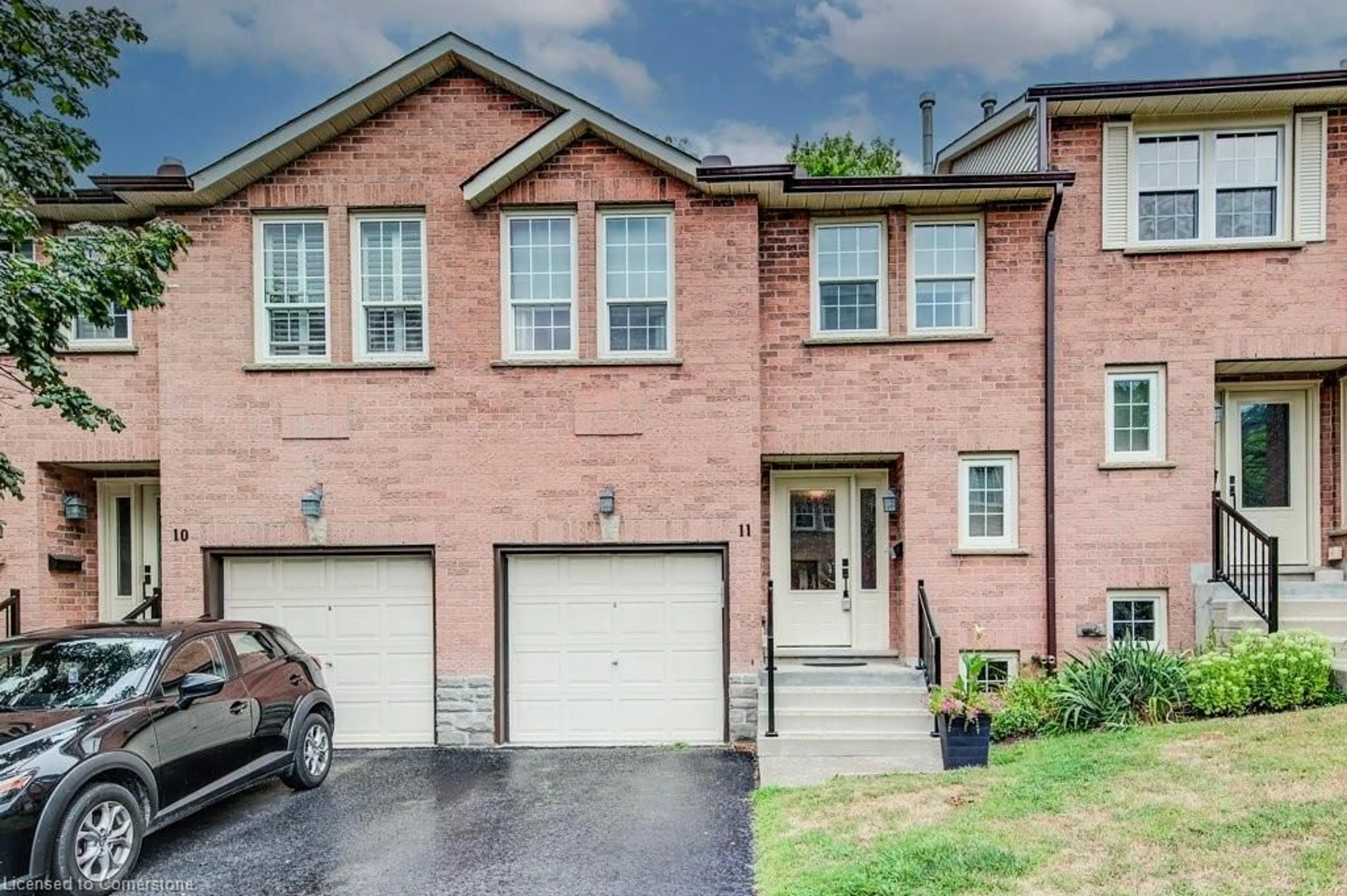 Home with brick exterior material, street for 375 Holiday Inn Dr #11, Cambridge Ontario N3C 3P6