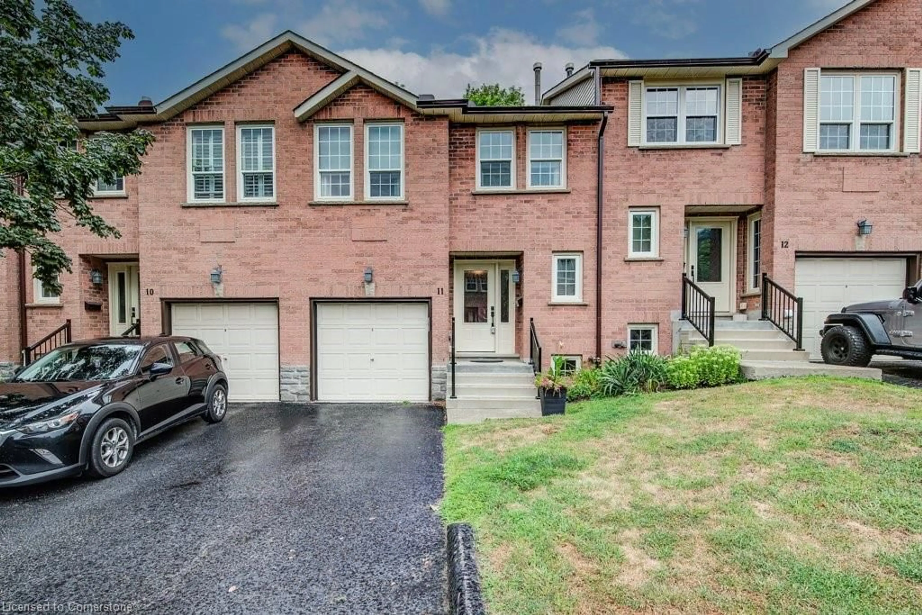 Home with brick exterior material, street for 375 Holiday Inn Dr #11, Cambridge Ontario N3C 3P6