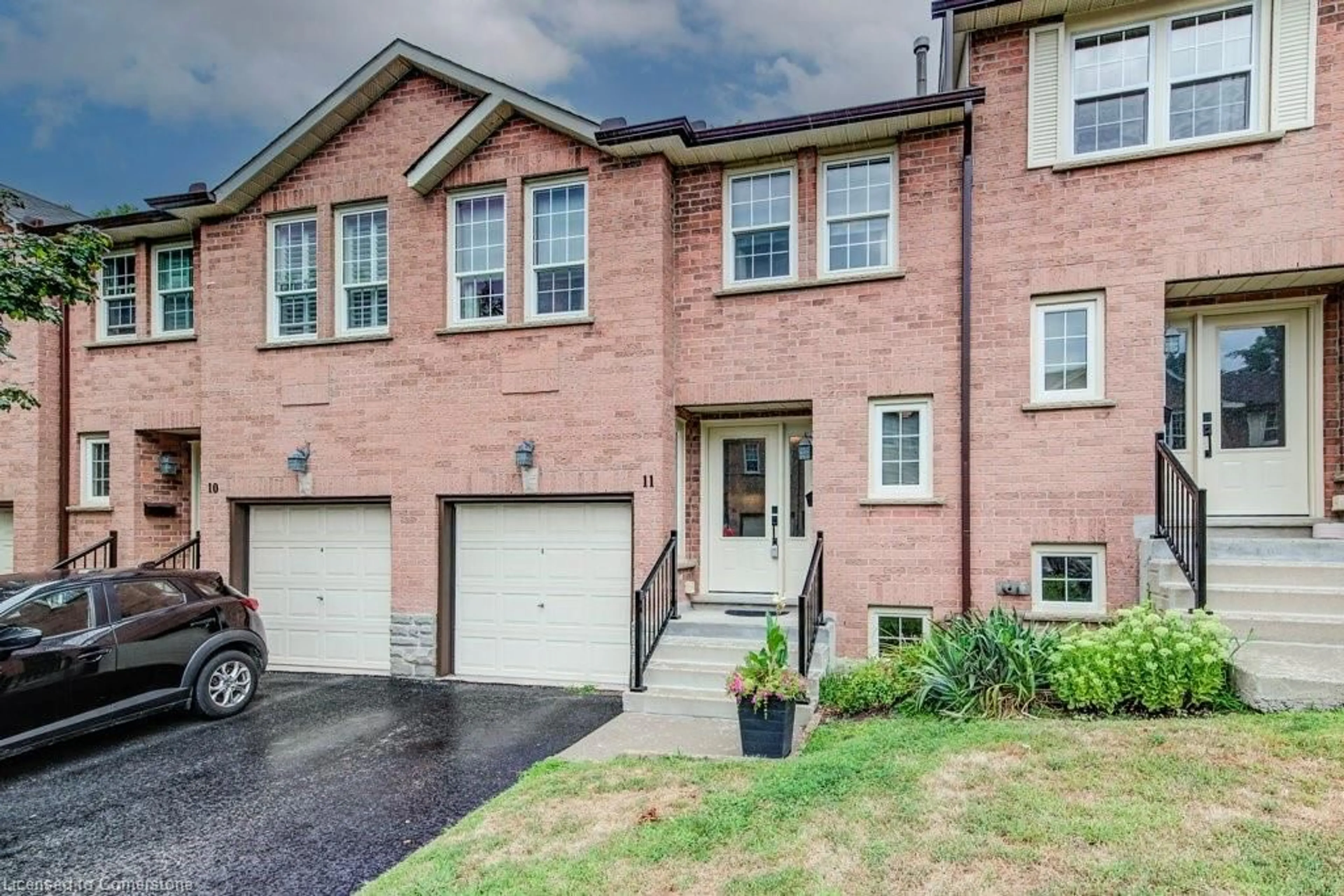 Home with brick exterior material, street for 375 Holiday Inn Dr #11, Cambridge Ontario N3C 3P6