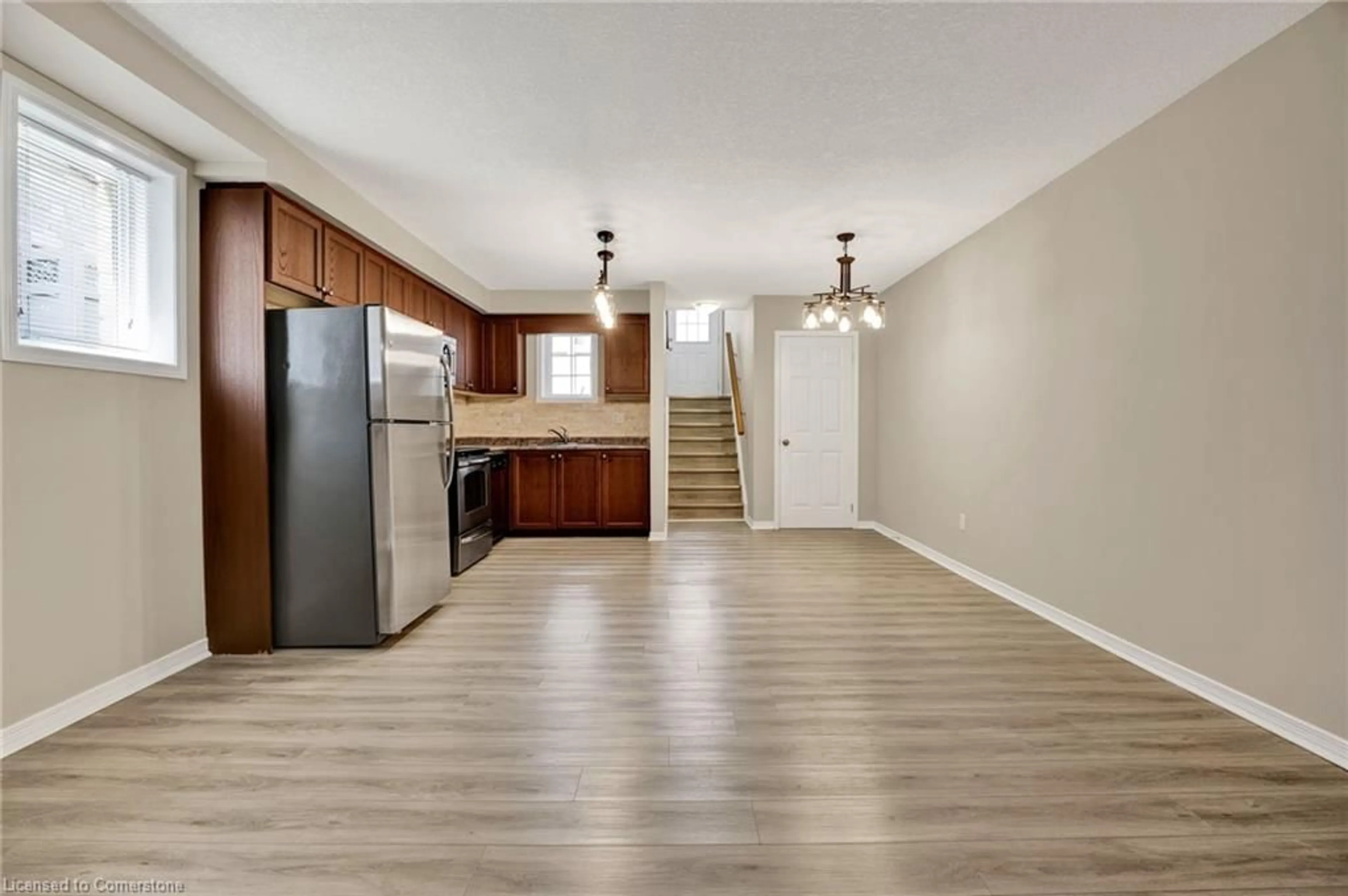 Open concept kitchen, wood/laminate floor for 931 Glasgow St #12D, Kitchener Ontario N2N 0B6