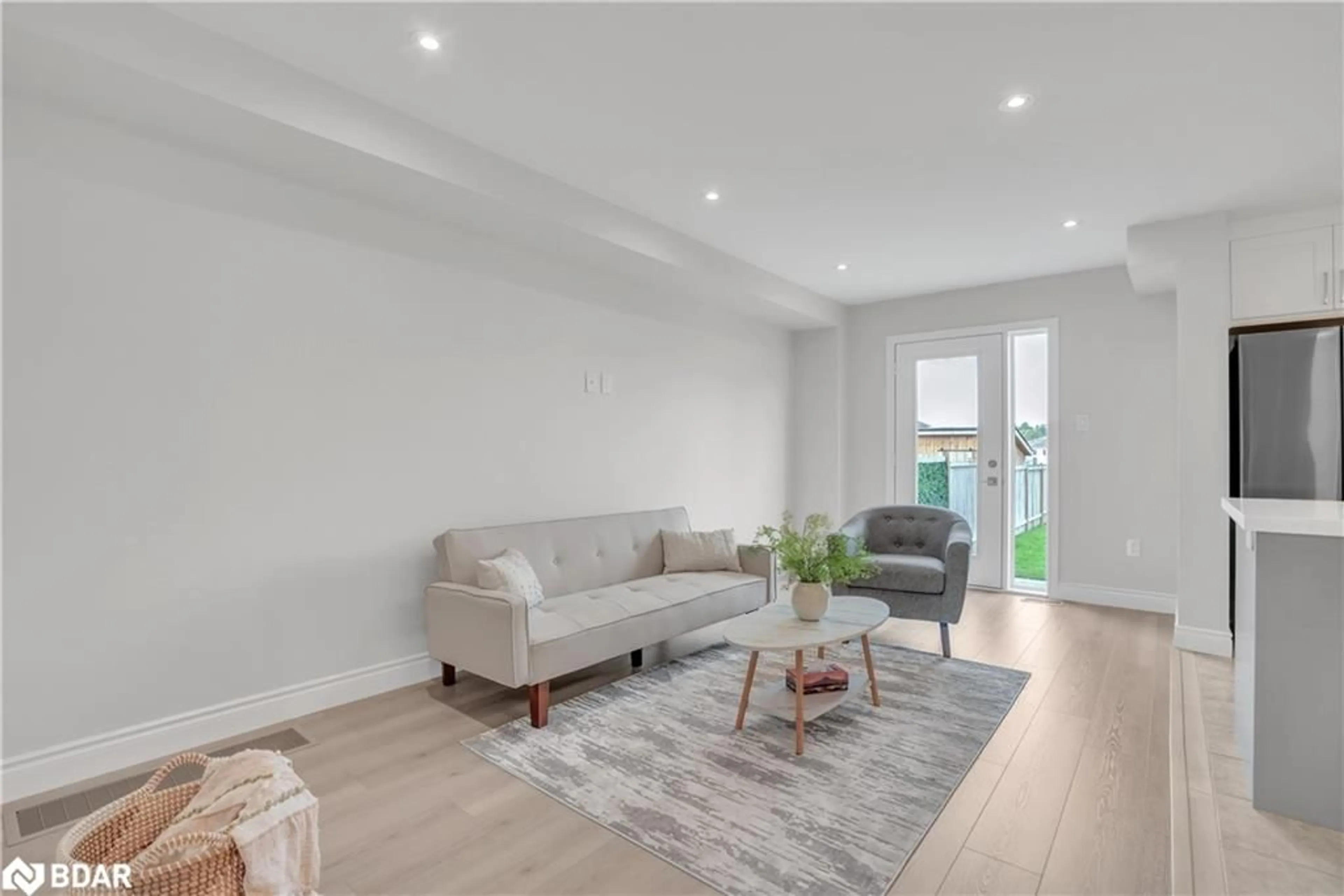Living room with furniture, wood/laminate floor for 16 Admiral Cres, Angus Ontario L0M 1B4
