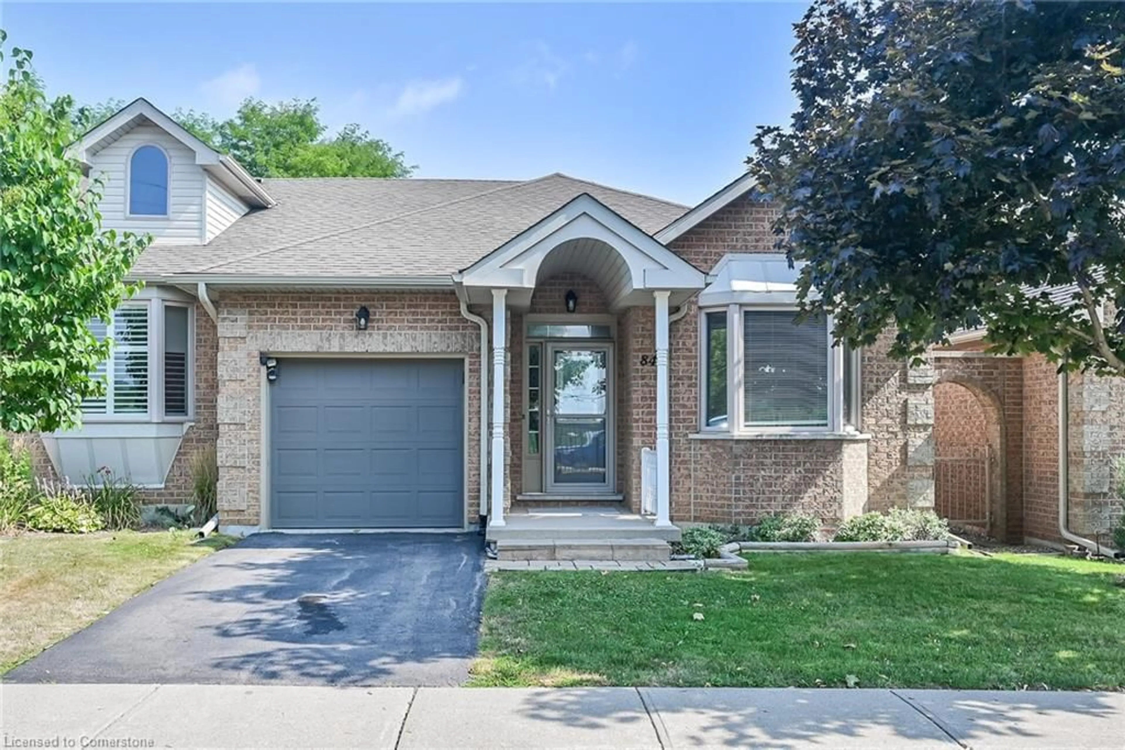 Home with brick exterior material, street for 84 Greentrail Dr, Mount Hope Ontario L0R 1W0