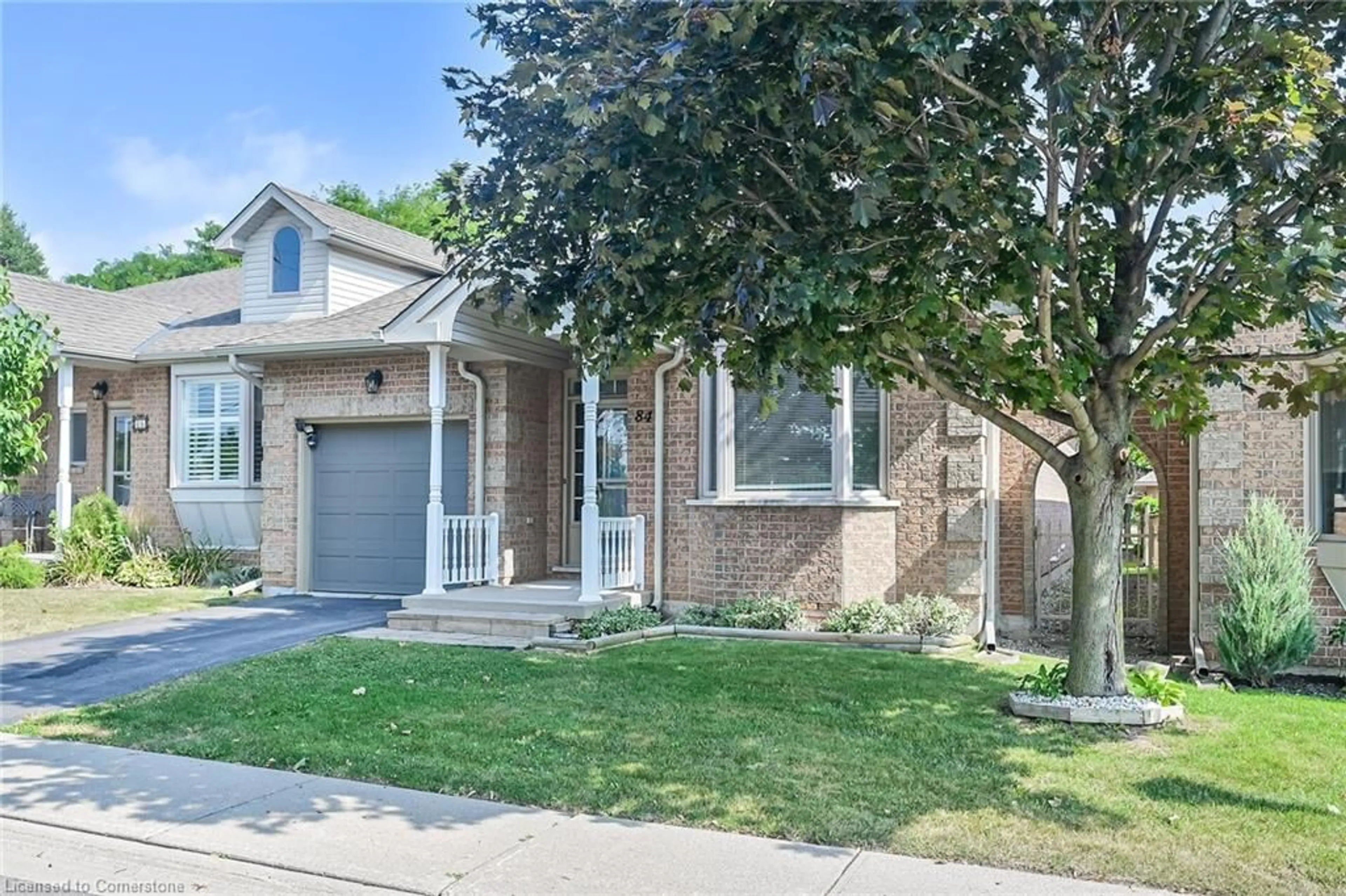 Home with brick exterior material, street for 84 Greentrail Dr, Mount Hope Ontario L0R 1W0