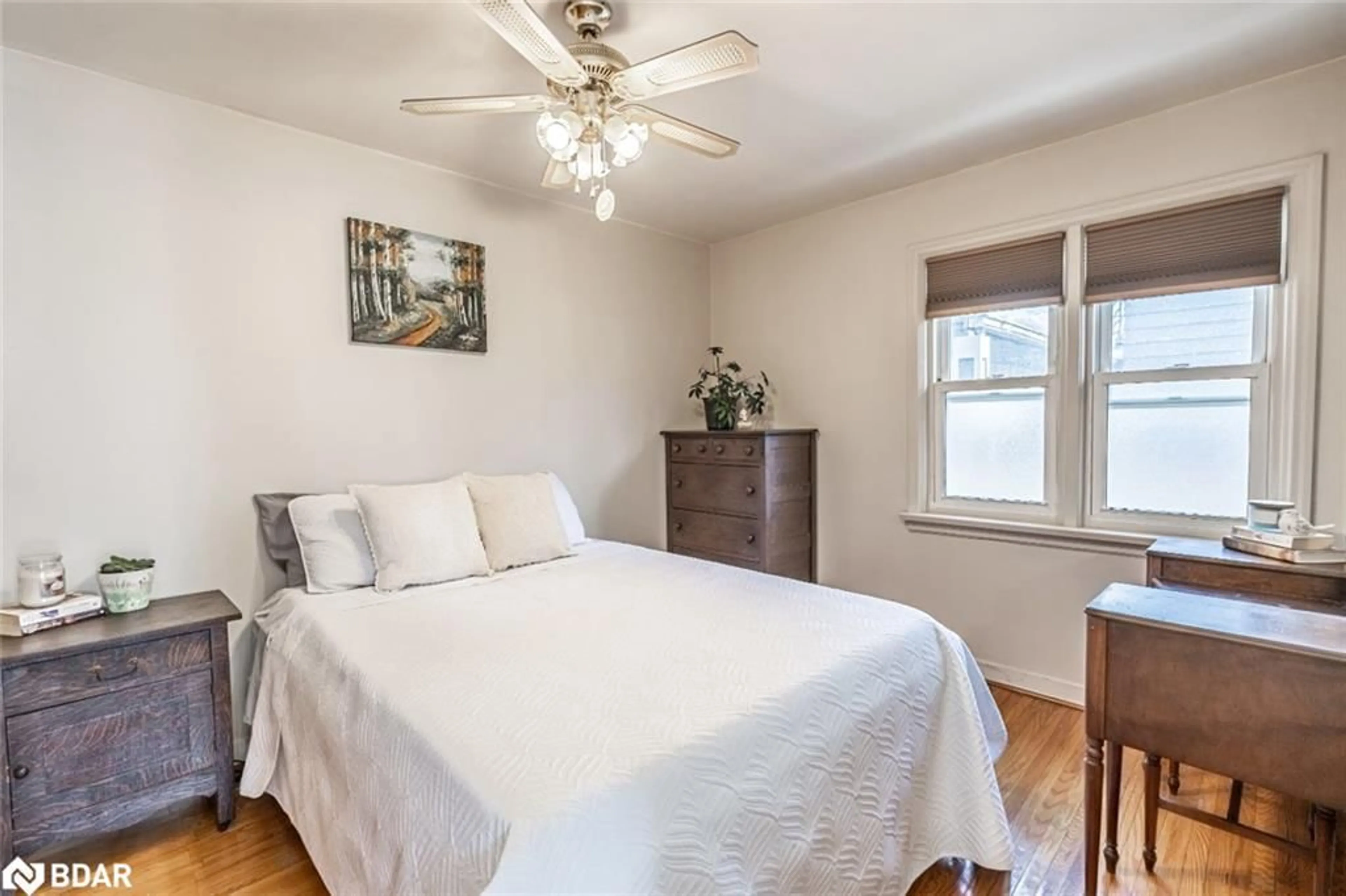 Bedroom with bed, wood/laminate floor for 98 Donald St, Barrie Ontario L4N 1E3