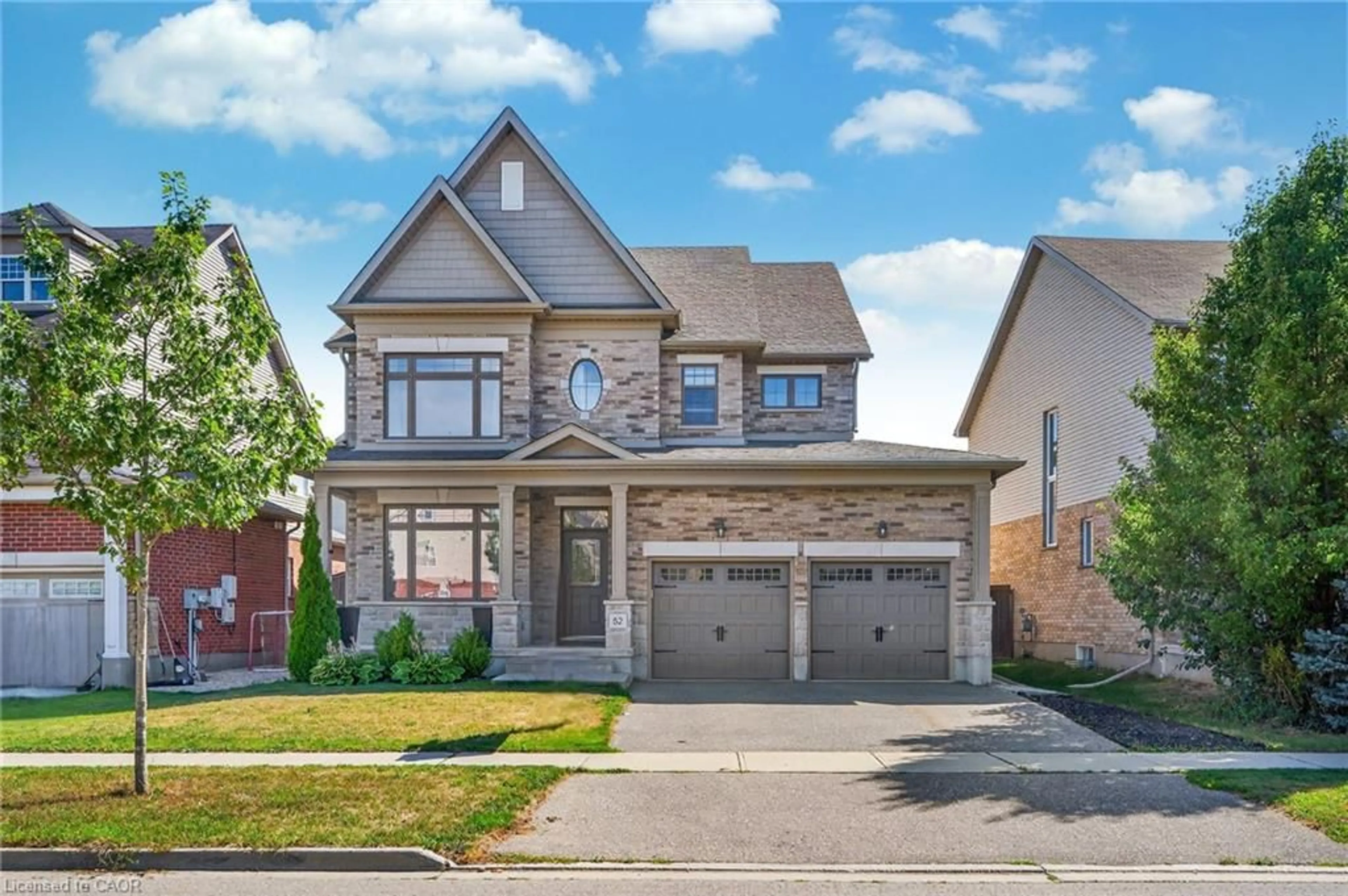 Home with brick exterior material, street for 52 Tremaine Dr, Kitchener Ontario N2A 4L7