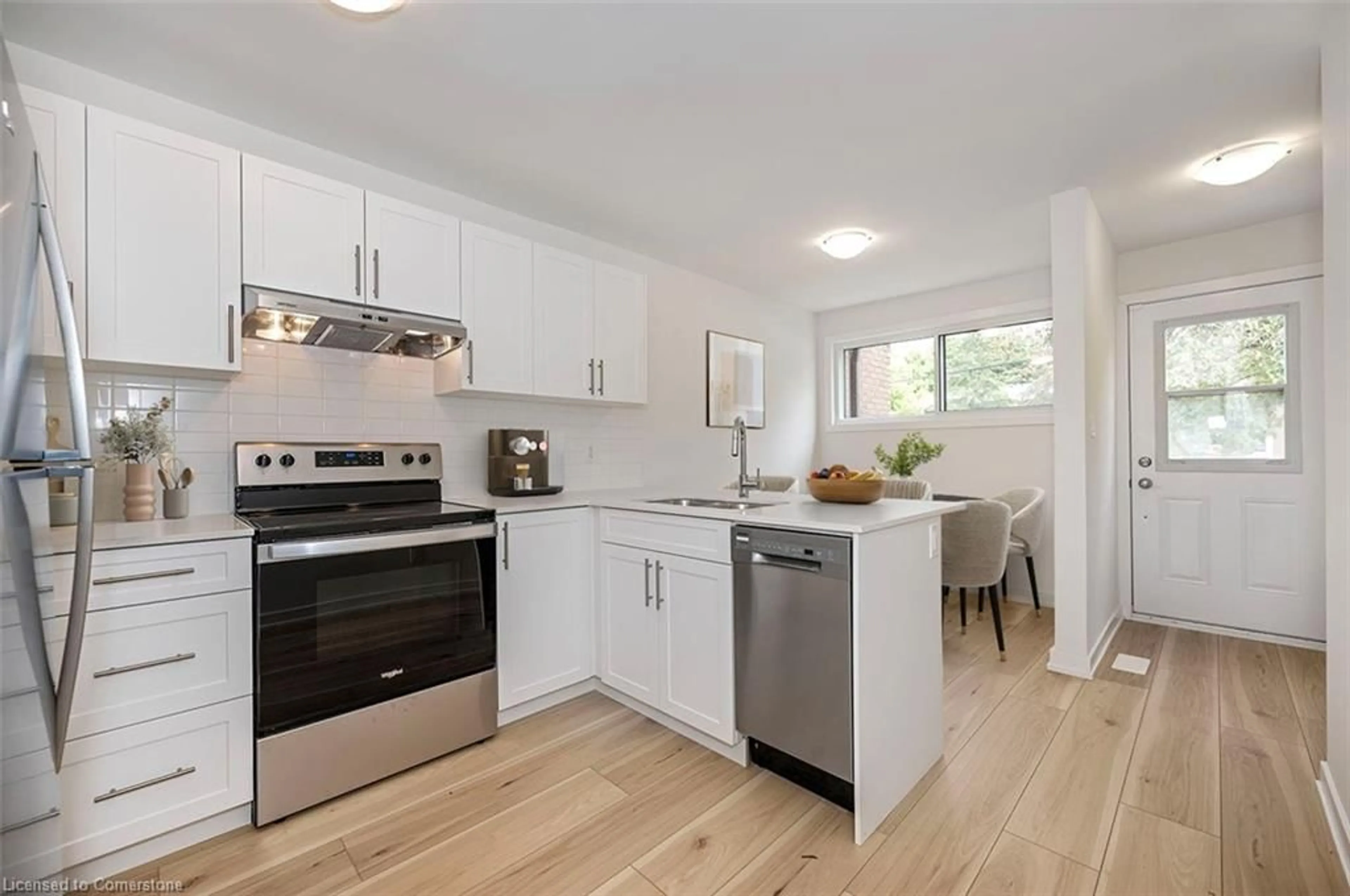 Open concept kitchen, wood/laminate floor for 73 Woodman Dr, Hamilton Ontario L8H 2M1