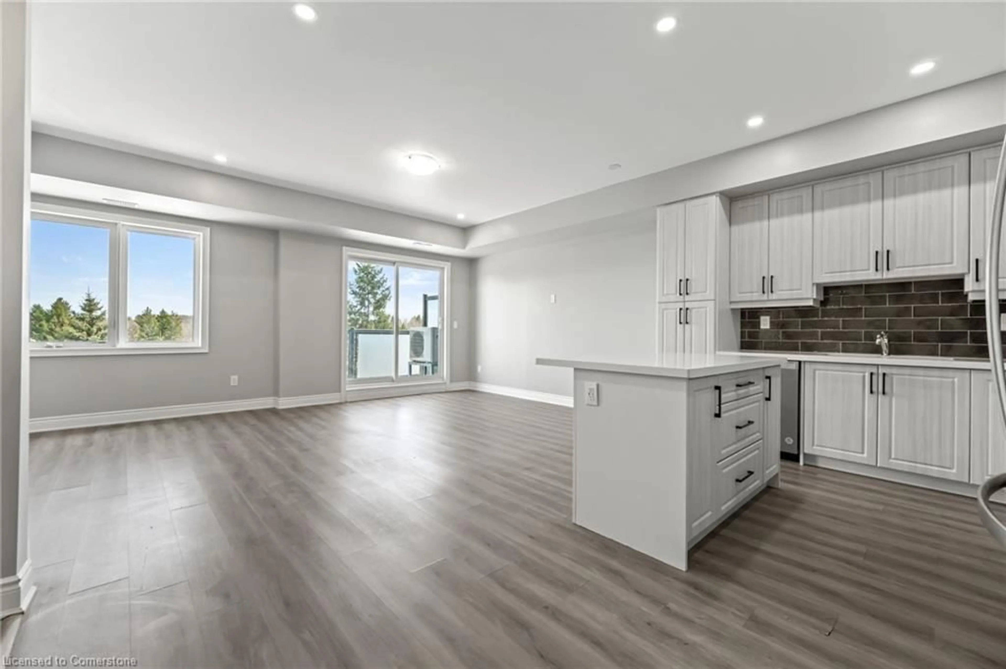 Open concept kitchen, wood/laminate floor for 721 Franklin Blvd #302, Cambridge Ontario N1R 5S4