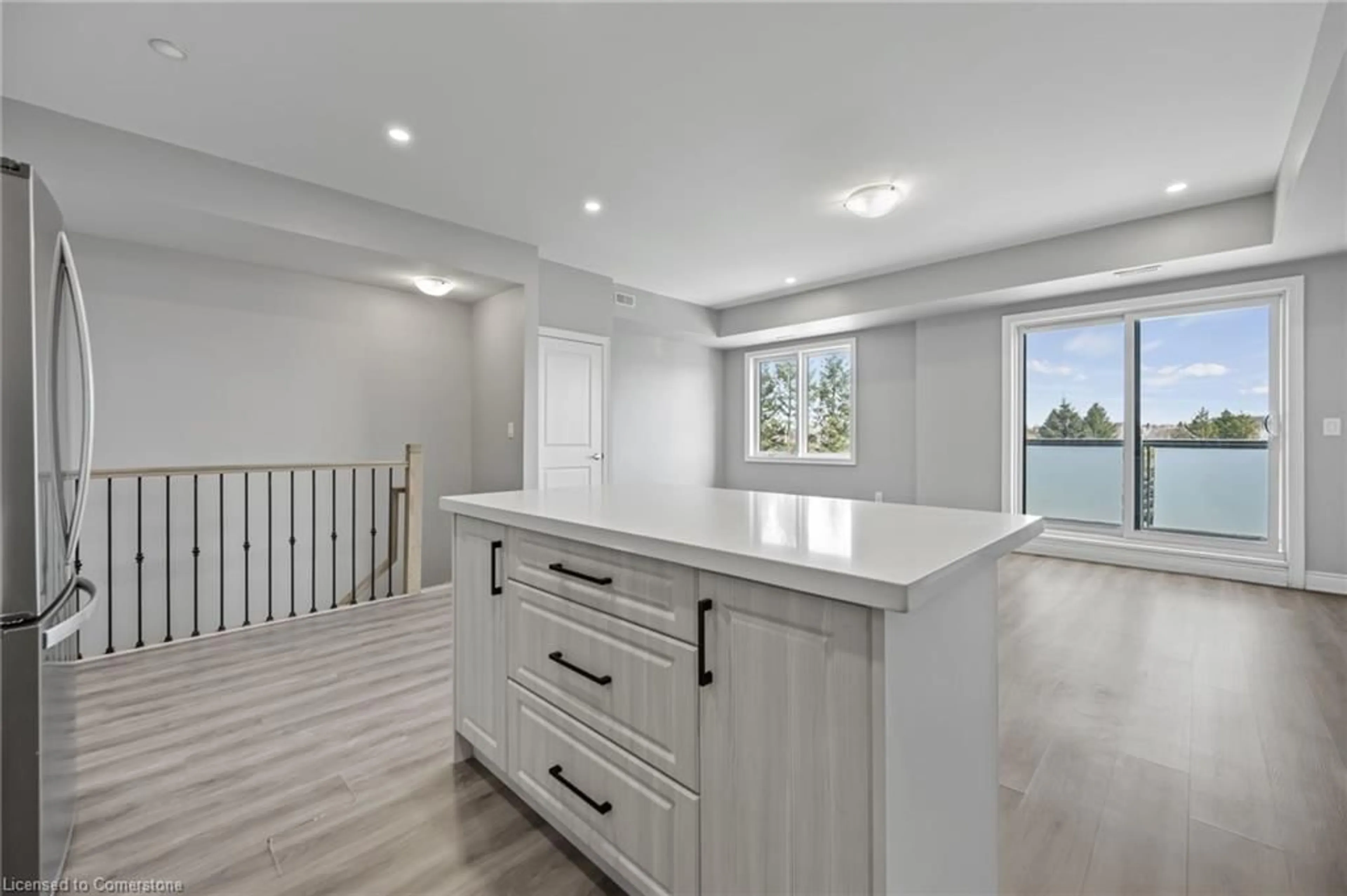 Open concept kitchen, wood/laminate floor for 721 Franklin Blvd #302, Cambridge Ontario N1R 5S4