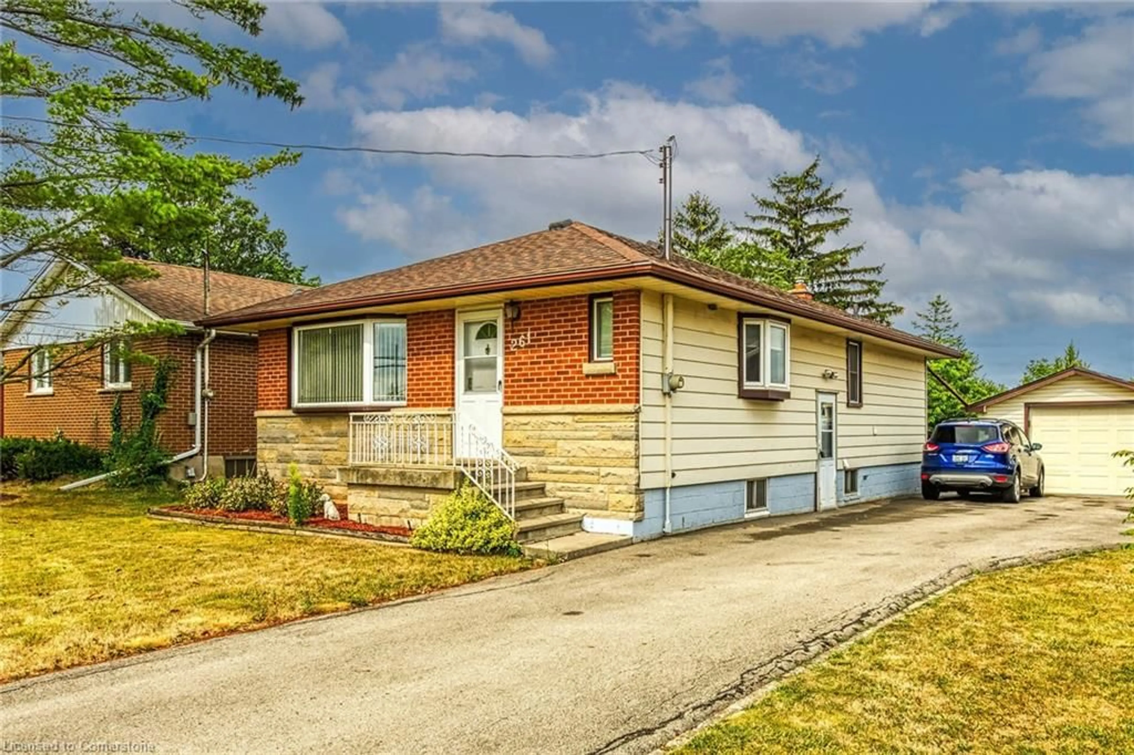 Home with brick exterior material, street for 261 Mcneilly Rd, Stoney Creek Ontario L8E 5H2