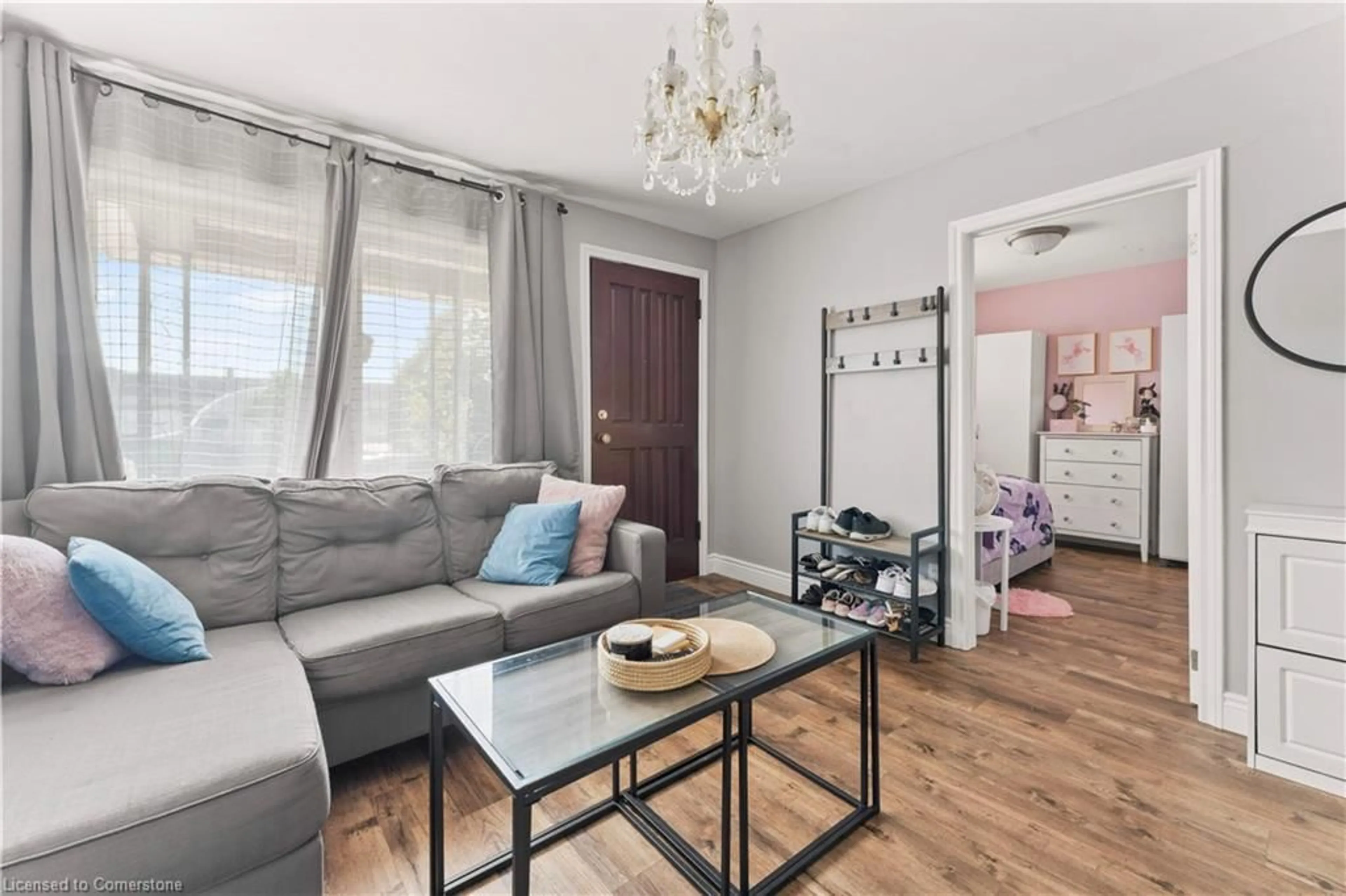 Living room with furniture, wood/laminate floor for 1550 St Luke Rd, Windsor Ontario N8Y 3N3