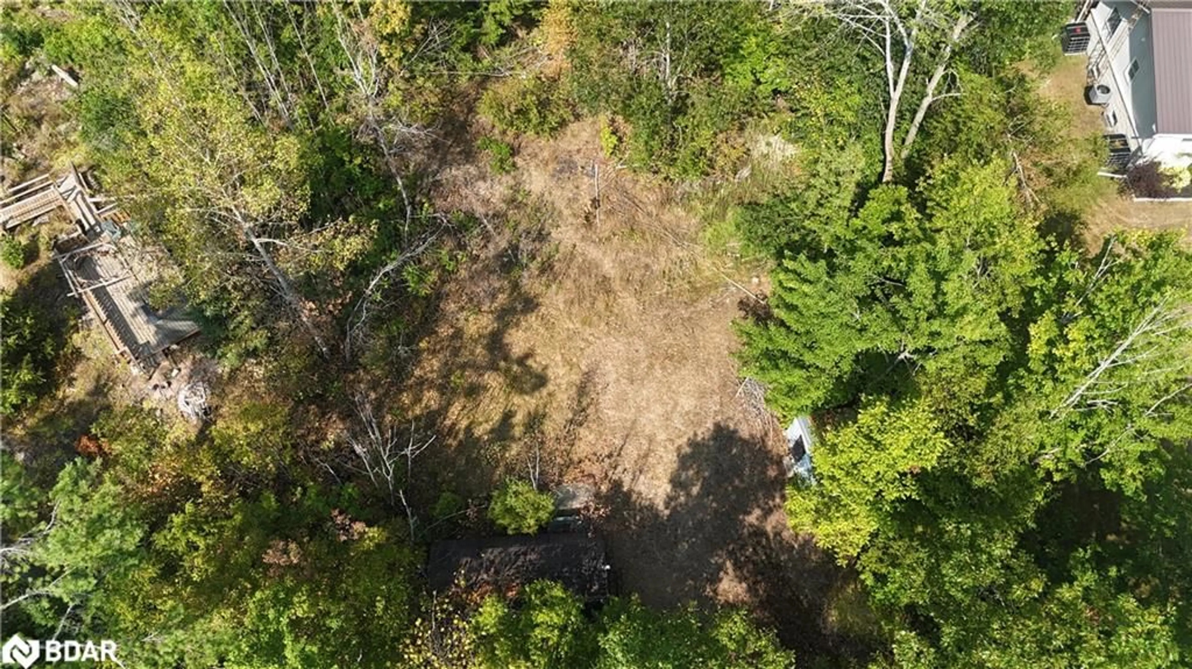 A pic from outside/outdoor area/front of a property/back of a property/a pic from drone, forest/trees view for 400 Kennedy Dr, Bobcaygeon Ontario K0M 1A0