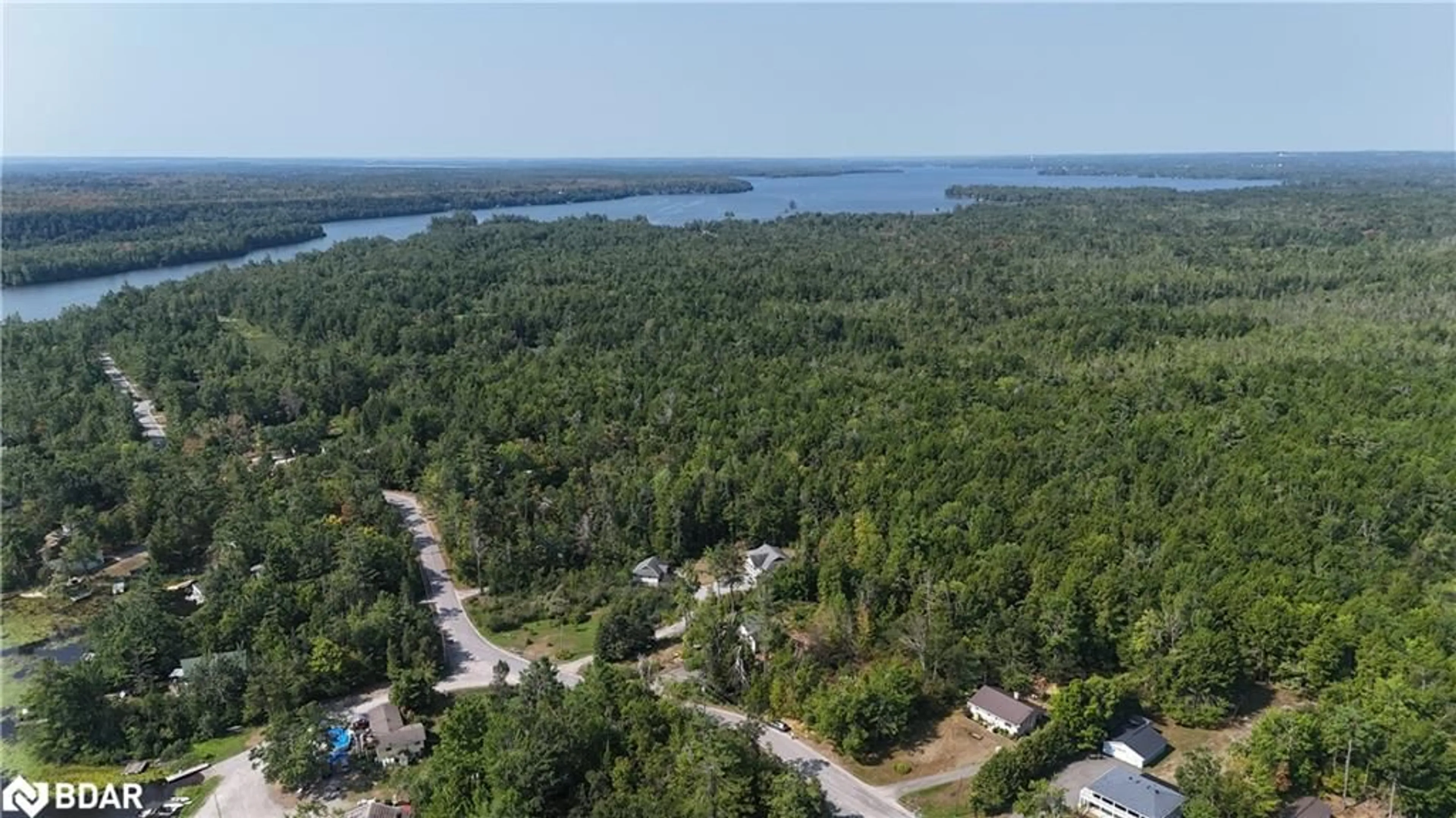 A pic from outside/outdoor area/front of a property/back of a property/a pic from drone, water/lake/river/ocean view for 400 Kennedy Dr, Bobcaygeon Ontario K0M 1A0