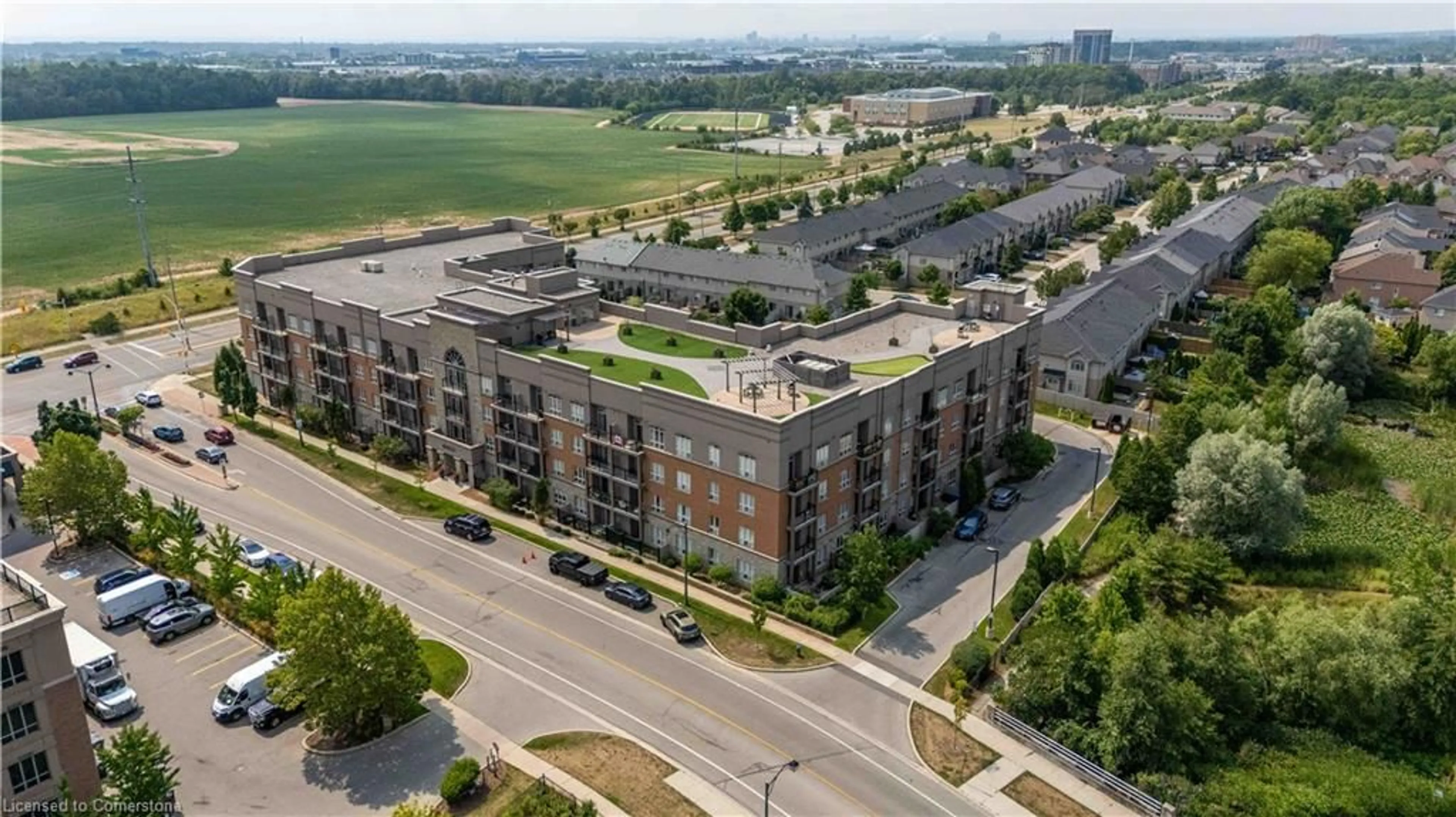 A pic from outside/outdoor area/front of a property/back of a property/a pic from drone, city buildings view from balcony for 5317 Upper Middle Rd #422, Burlington Ontario L7L 0G8