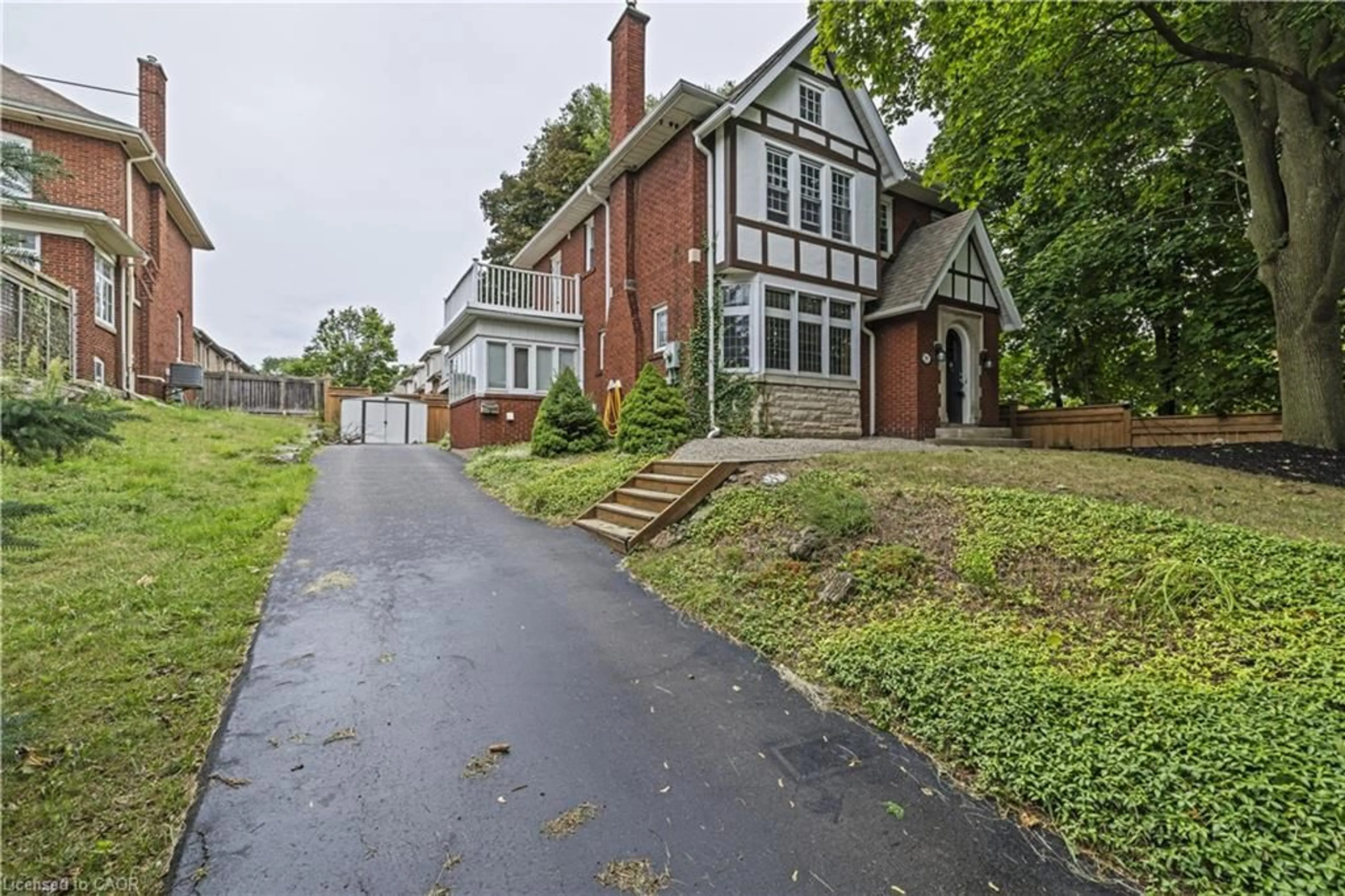 Home with brick exterior material, street for 295 Plains Rd, Burlington Ontario L7T 1G1