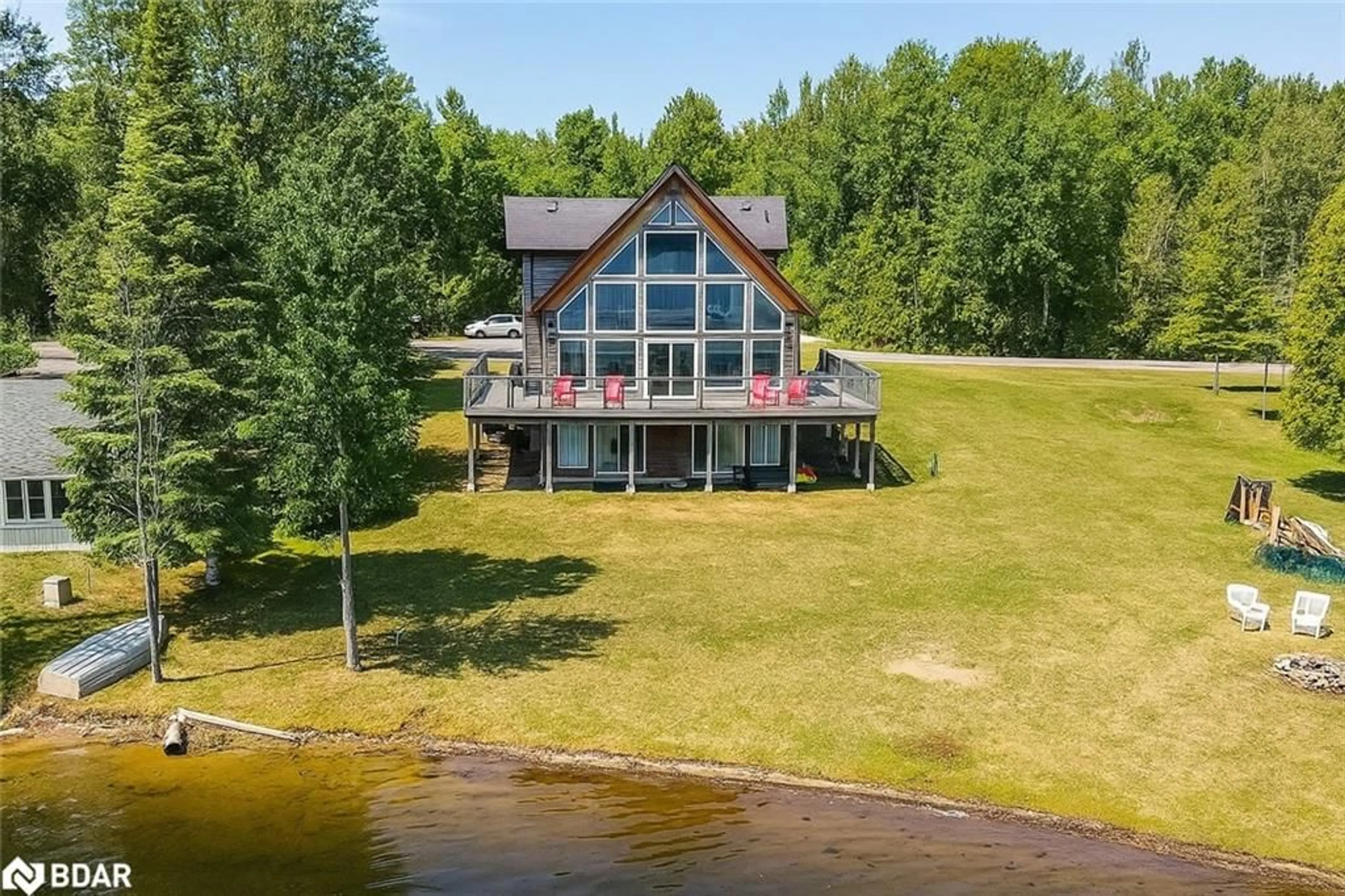 A pic from outside/outdoor area/front of a property/back of a property/a pic from drone, water/lake/river/ocean view for 3093 Sandy Bend Rd, Elmvale Ontario L0L 1P0