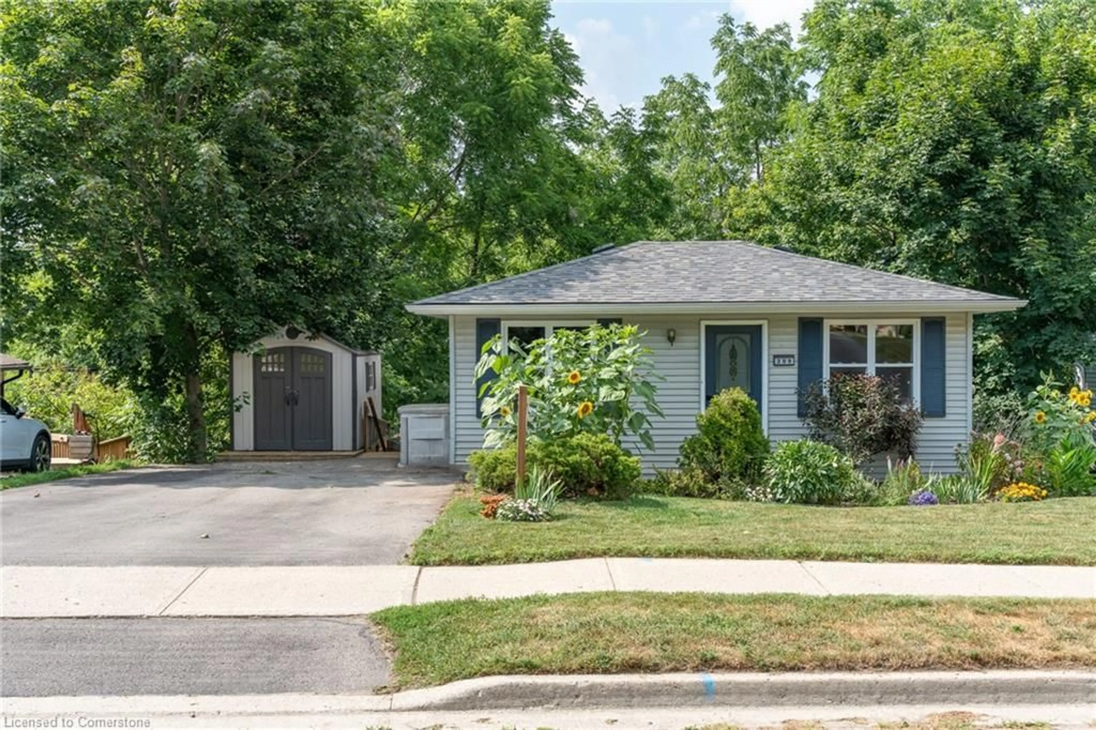 Home with vinyl exterior material, street for 209 Wellington St, Wellington Ontario N1M 3E1