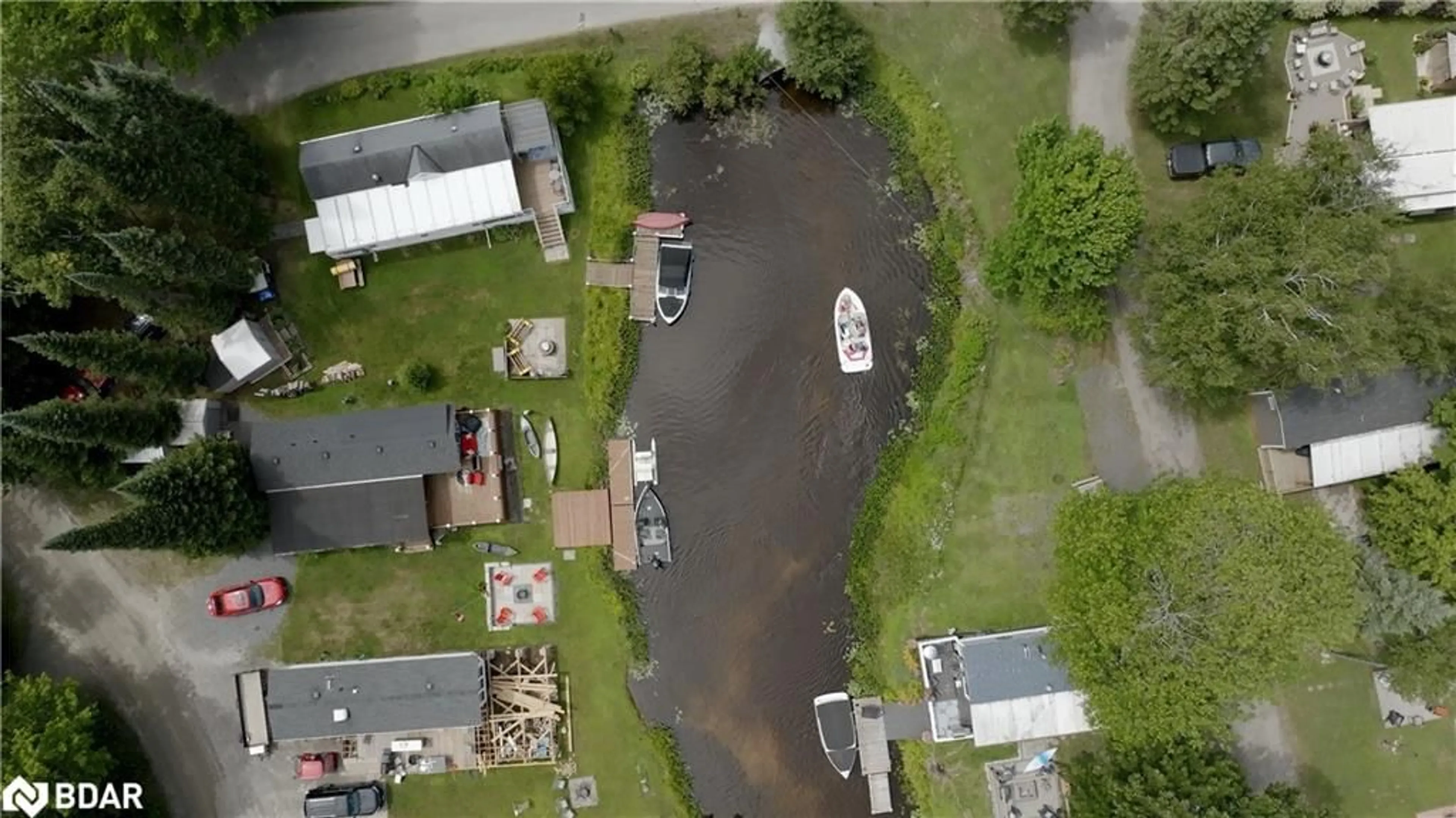 A pic from outside/outdoor area/front of a property/back of a property/a pic from drone, water/lake/river/ocean view for 85 Hutchinson Beach Rd #B56, Huntsville Ontario P1H 1N4