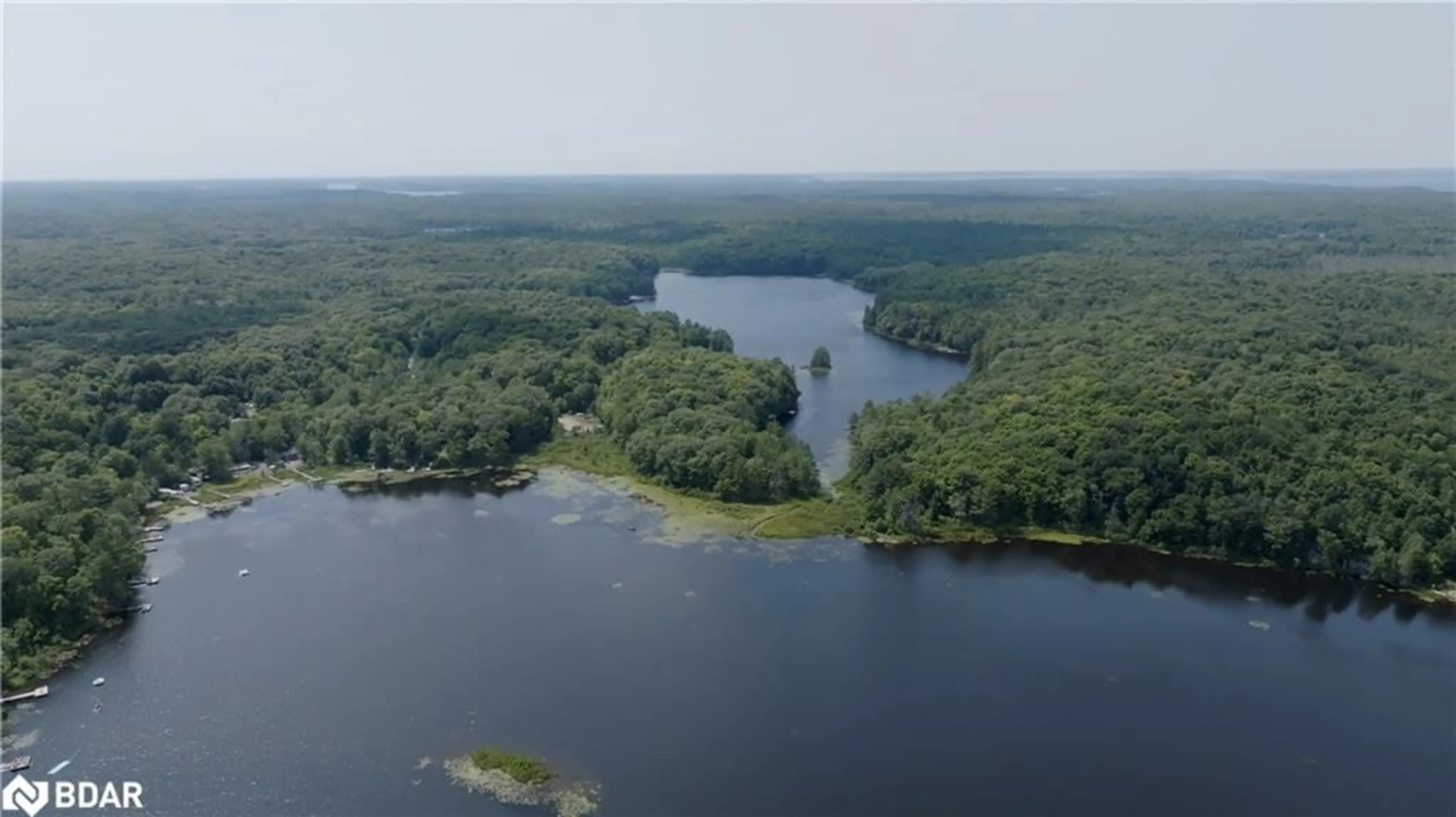 A pic from outside/outdoor area/front of a property/back of a property/a pic from drone, water/lake/river/ocean view for 105 Blue Lake Rd #RL88, Seguin Ontario P1H 1N4