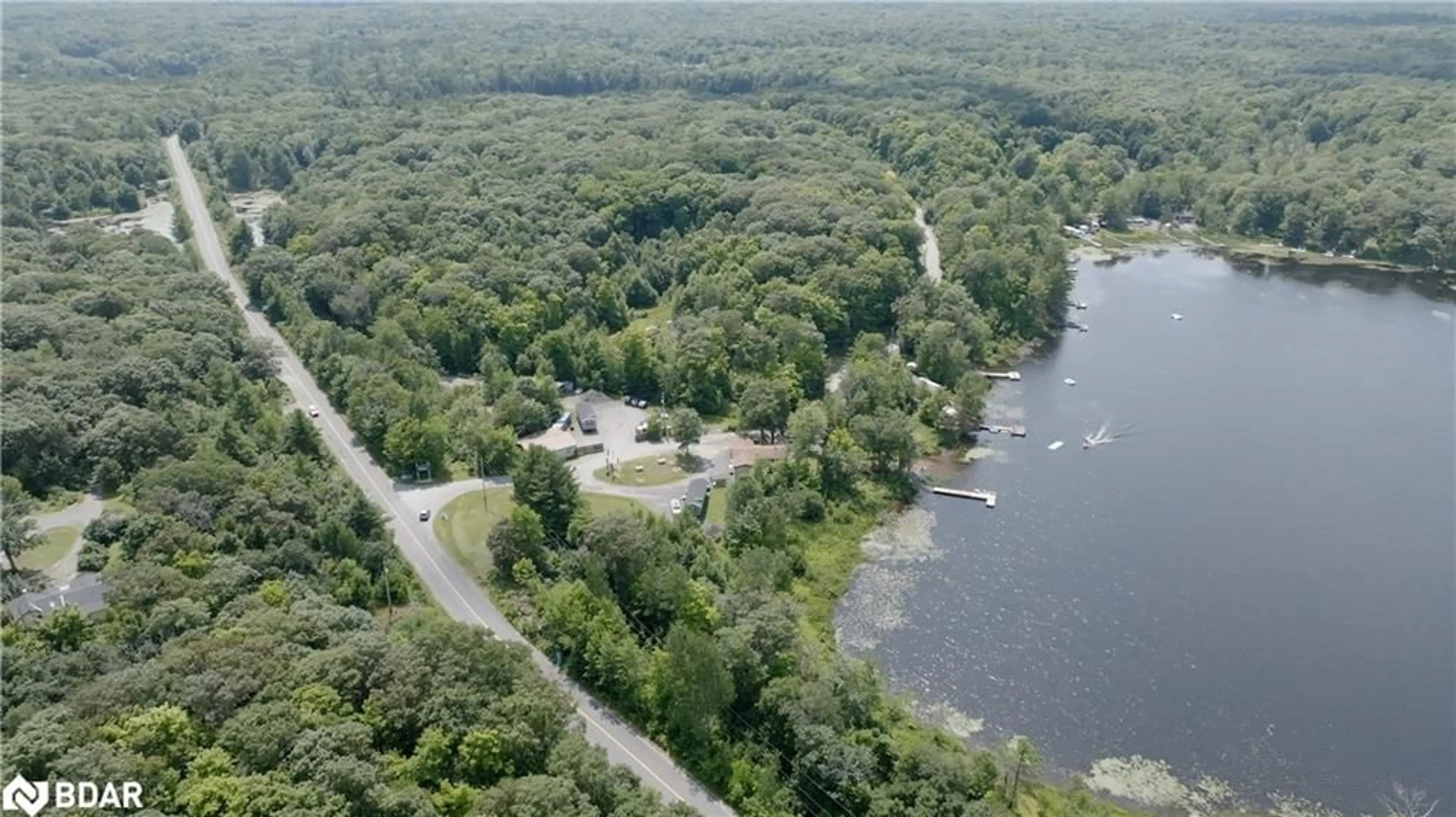A pic from outside/outdoor area/front of a property/back of a property/a pic from drone, water/lake/river/ocean view for 105 Blue Lake Rd #RL88, Seguin Ontario P1H 1N4