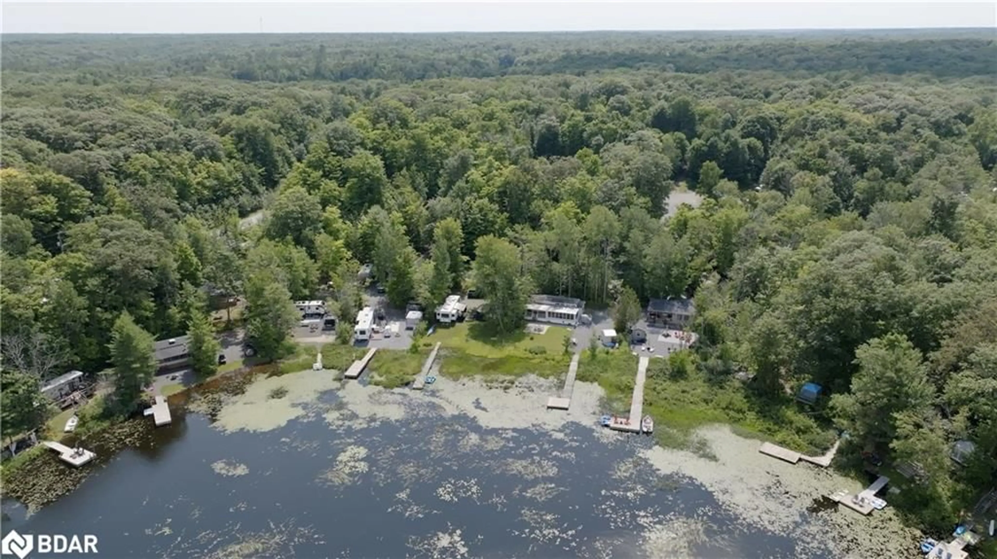 A pic from outside/outdoor area/front of a property/back of a property/a pic from drone, water/lake/river/ocean view for 105 Blue Lake Rd #RL88, Seguin Ontario P1H 1N4