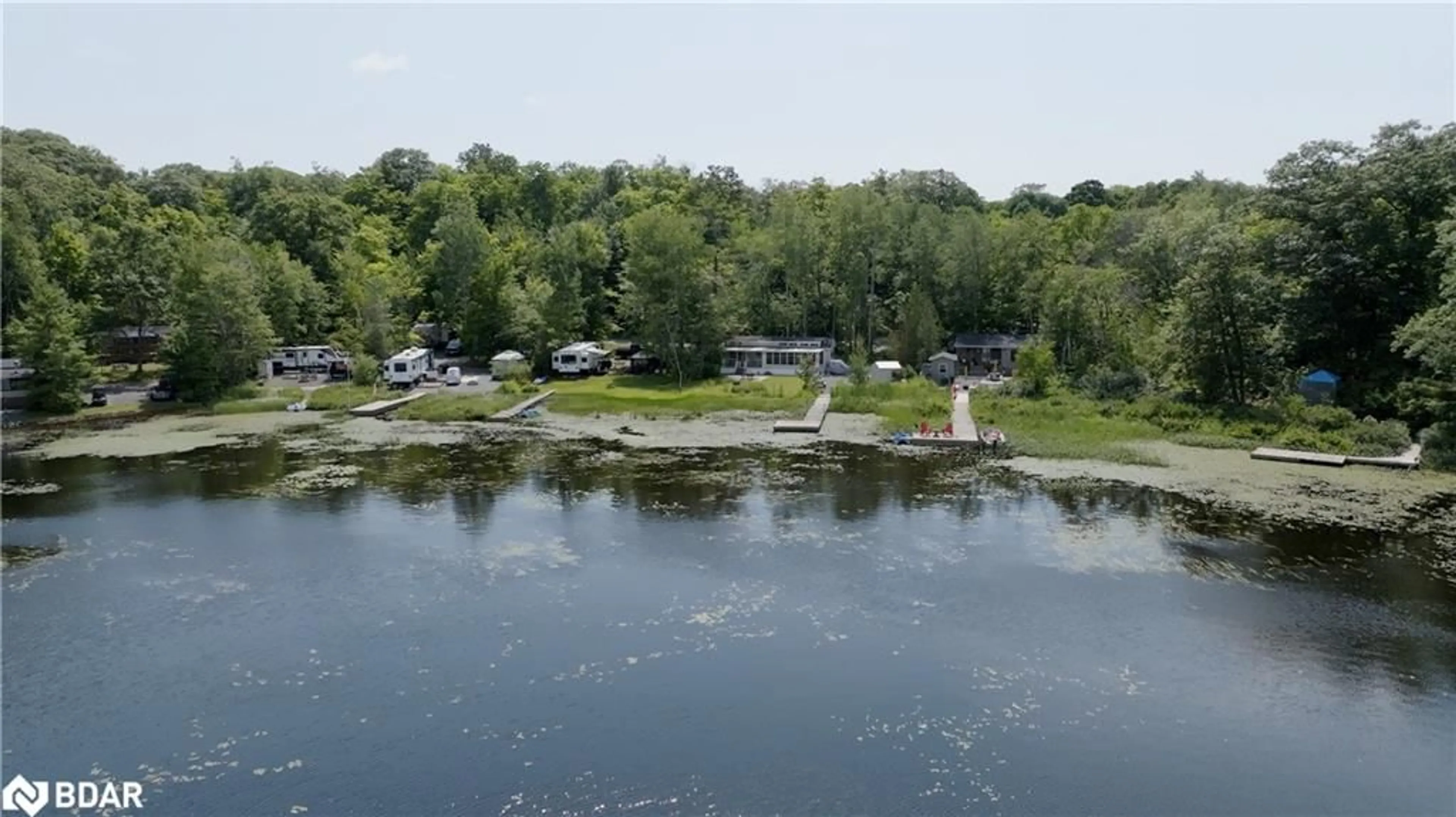 A pic from outside/outdoor area/front of a property/back of a property/a pic from drone, water/lake/river/ocean view for 105 Blue Lake Rd #RL88, Seguin Ontario P1H 1N4
