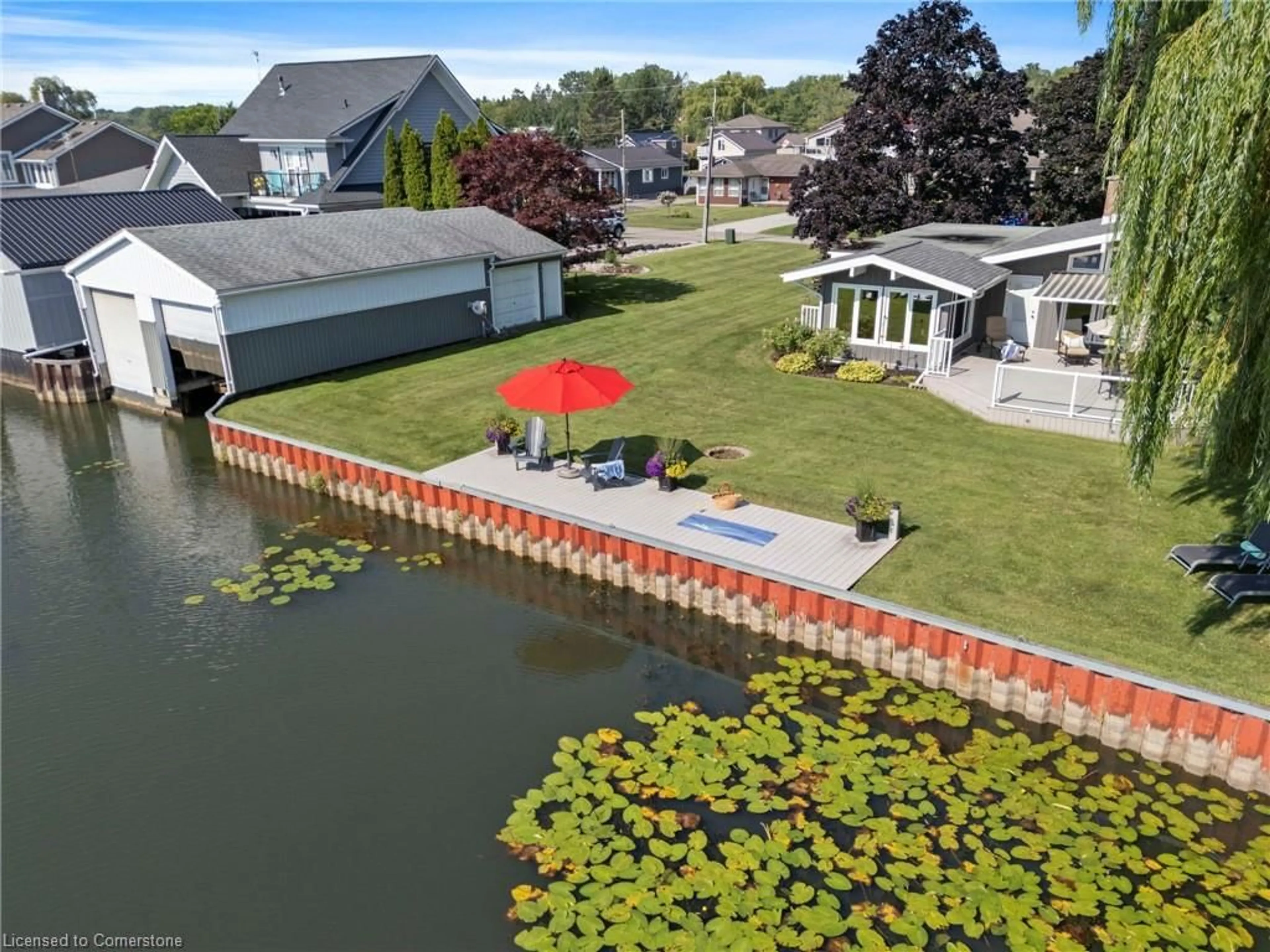 A pic from outside/outdoor area/front of a property/back of a property/a pic from drone, water/lake/river/ocean view for 392 Cedar Dr Dr, Charlotteville Ontario N0E 1T0