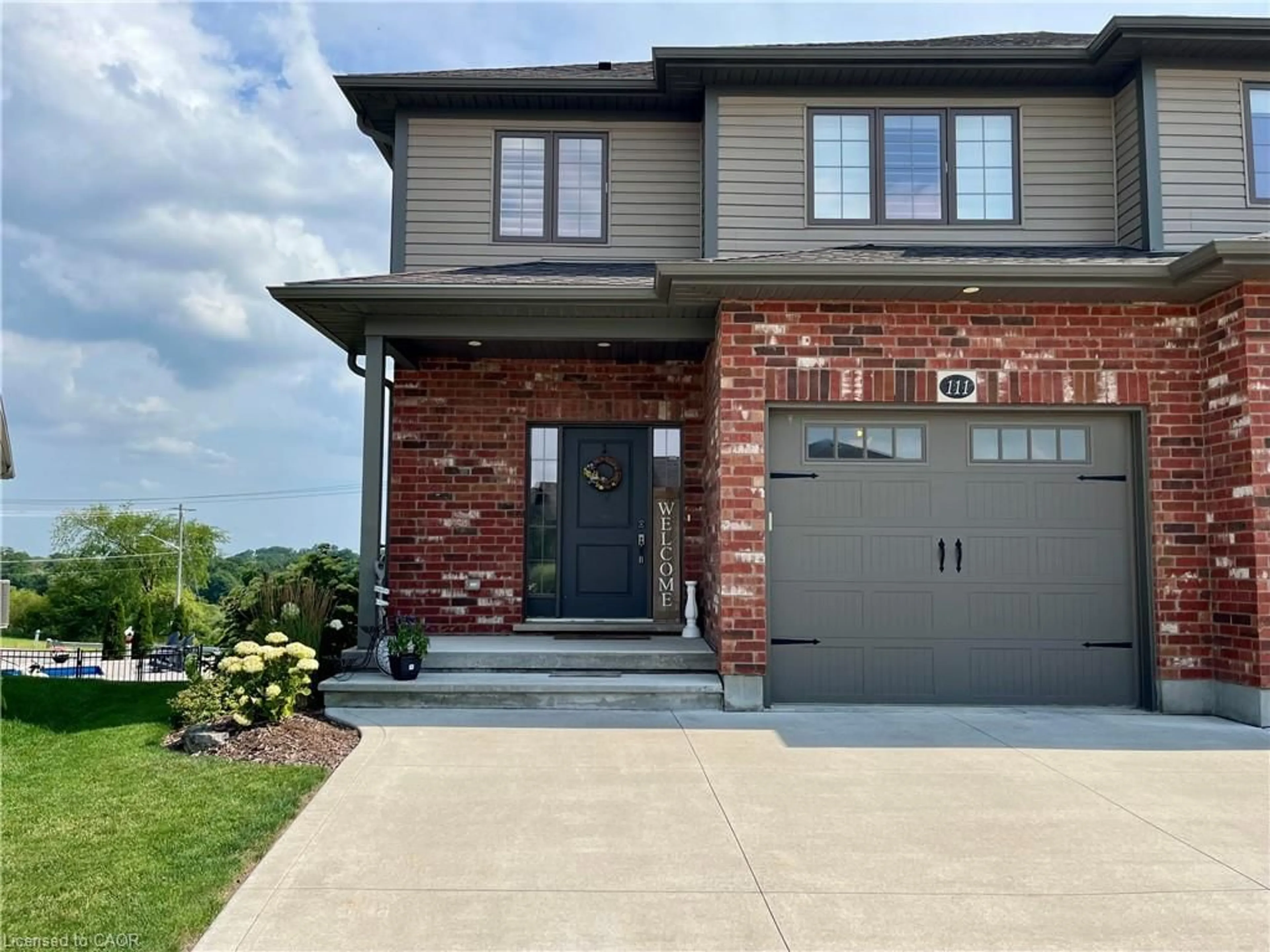 Home with brick exterior material, street for 111 Village Rd, Wellesley Ontario N0B 2T0