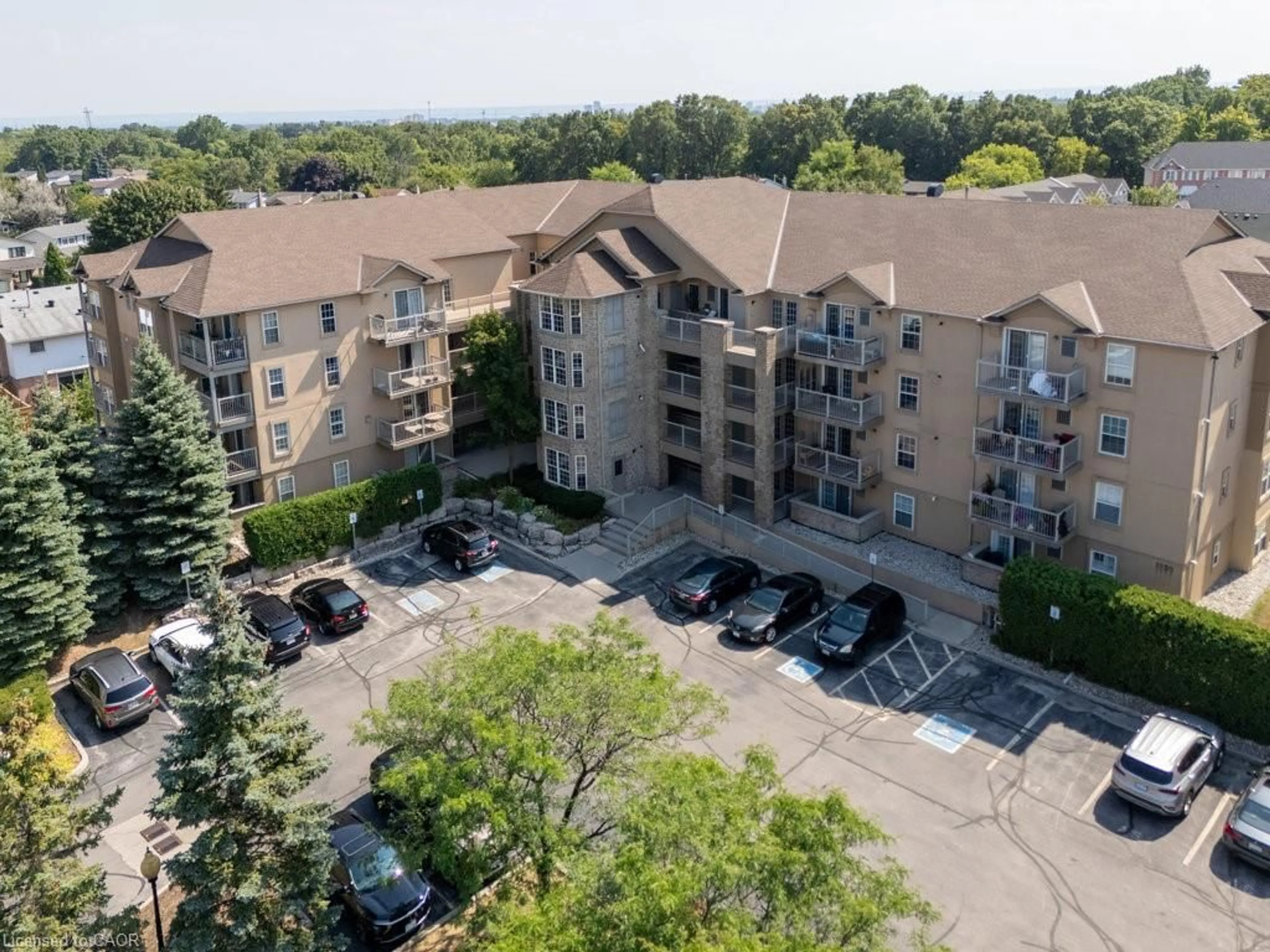 A pic from outside/outdoor area/front of a property/back of a property/a pic from drone, unknown for 1820 Walkers Line #411, Burlington Ontario L7M 4V4