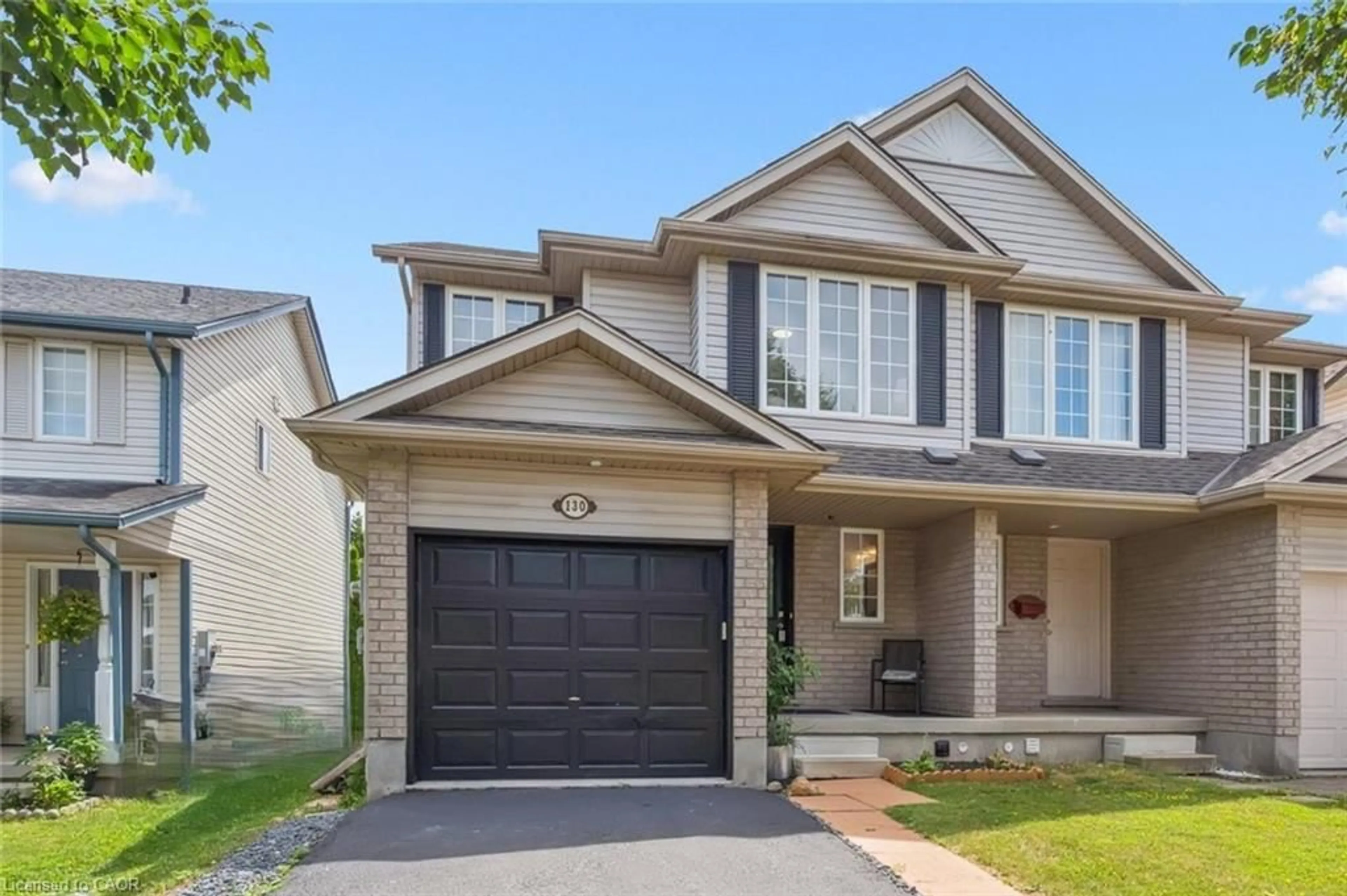 Home with brick exterior material, street for 130 Silurian Dr, Guelph Ontario N1E 7G1