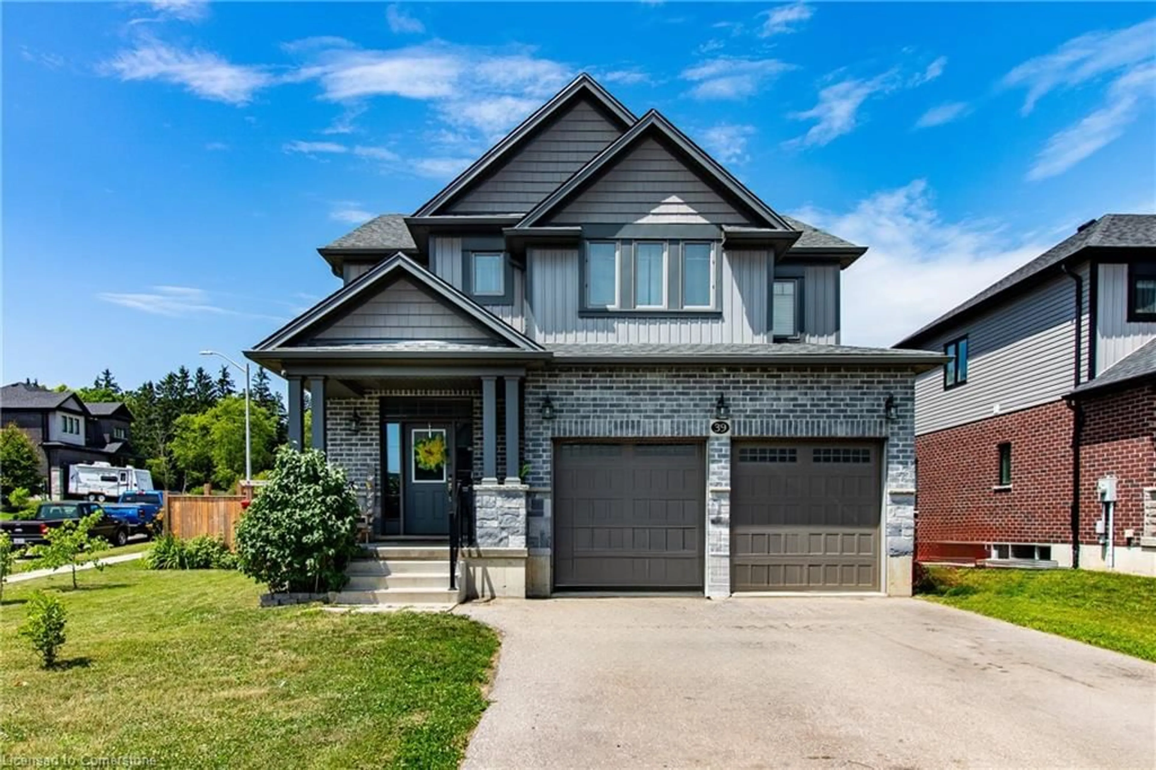 Home with brick exterior material, street for 39 Basswood Rd, Simcoe Ontario N3Y 0E1