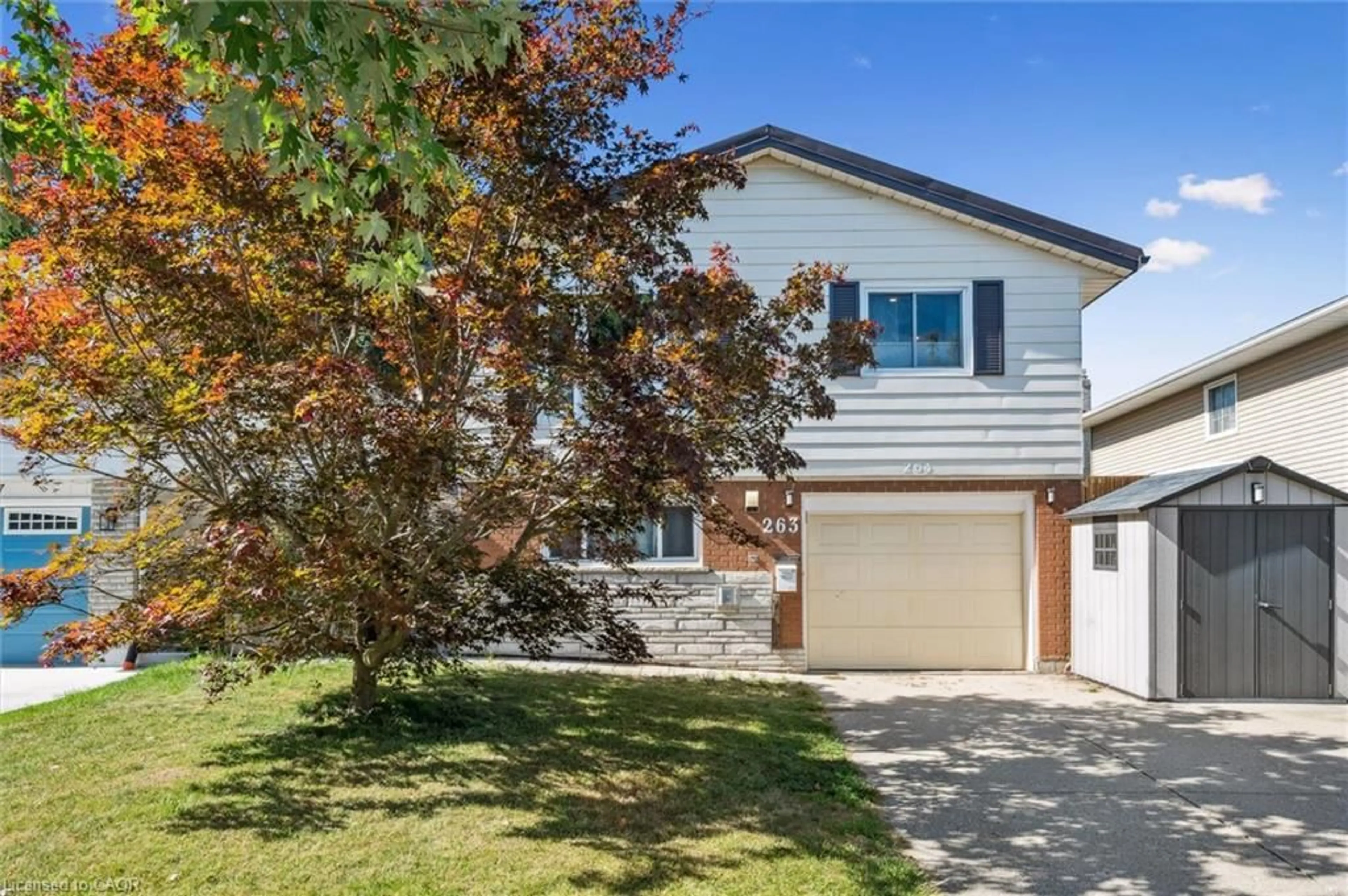 Home with vinyl exterior material, street for 263 The Country Way, Kitchener Ontario N2E 2V6