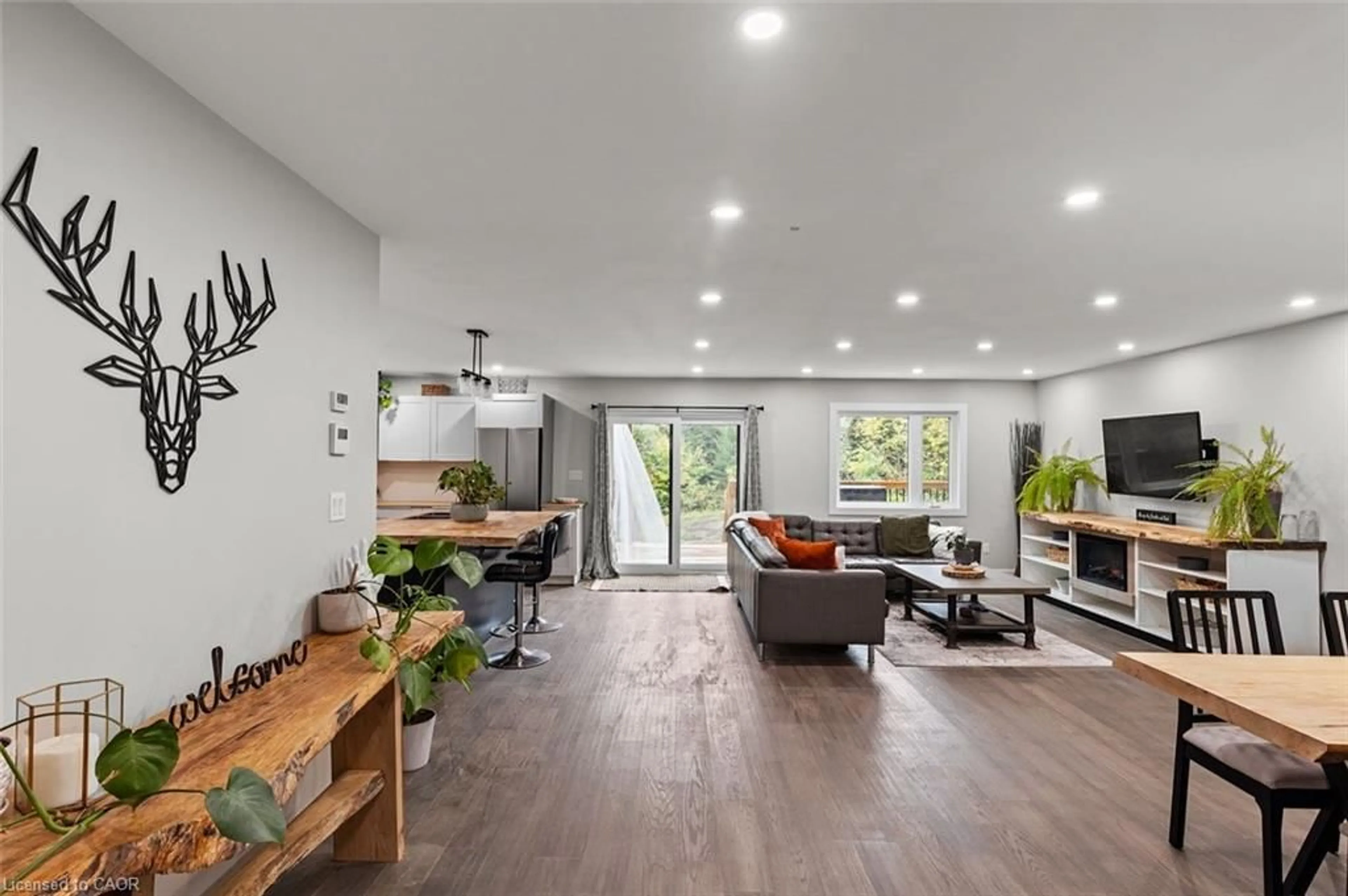 Living room with furniture, wood/laminate floor for 127 Paradise Road, Nipissing Ontario K0J 2M0