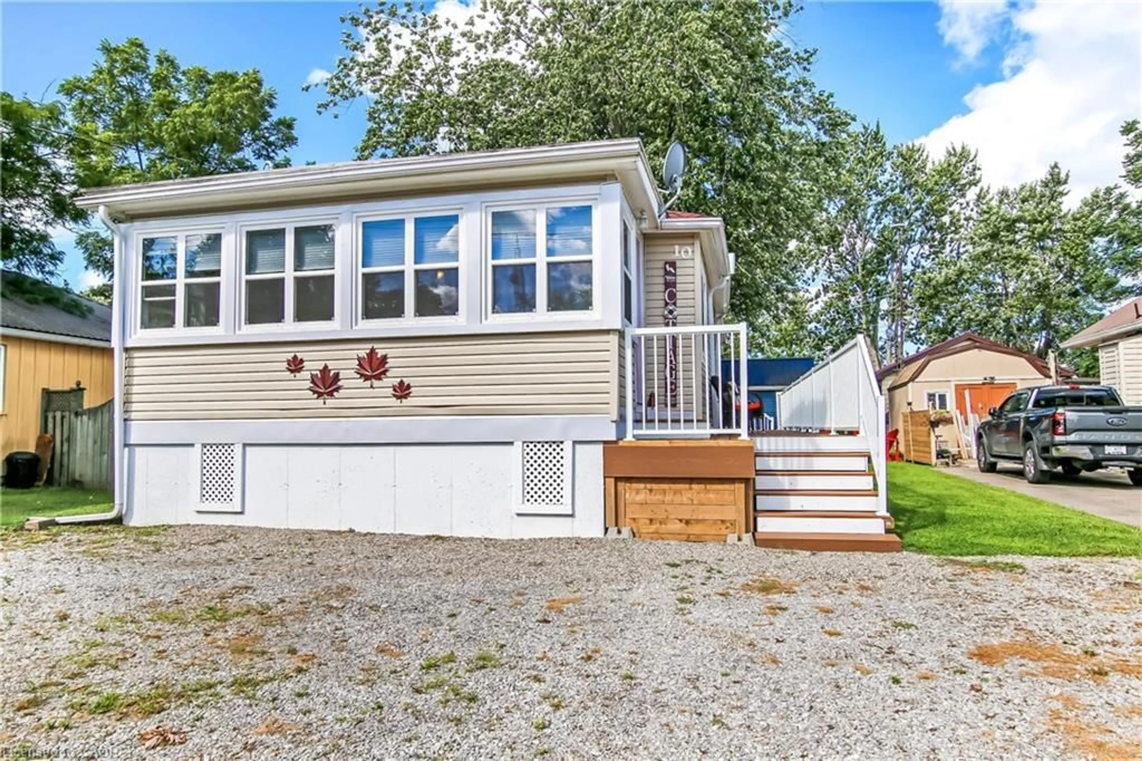 Home with vinyl exterior material, street for 10 Fourth Ave Ave, Long Point Ontario N0E 1M0