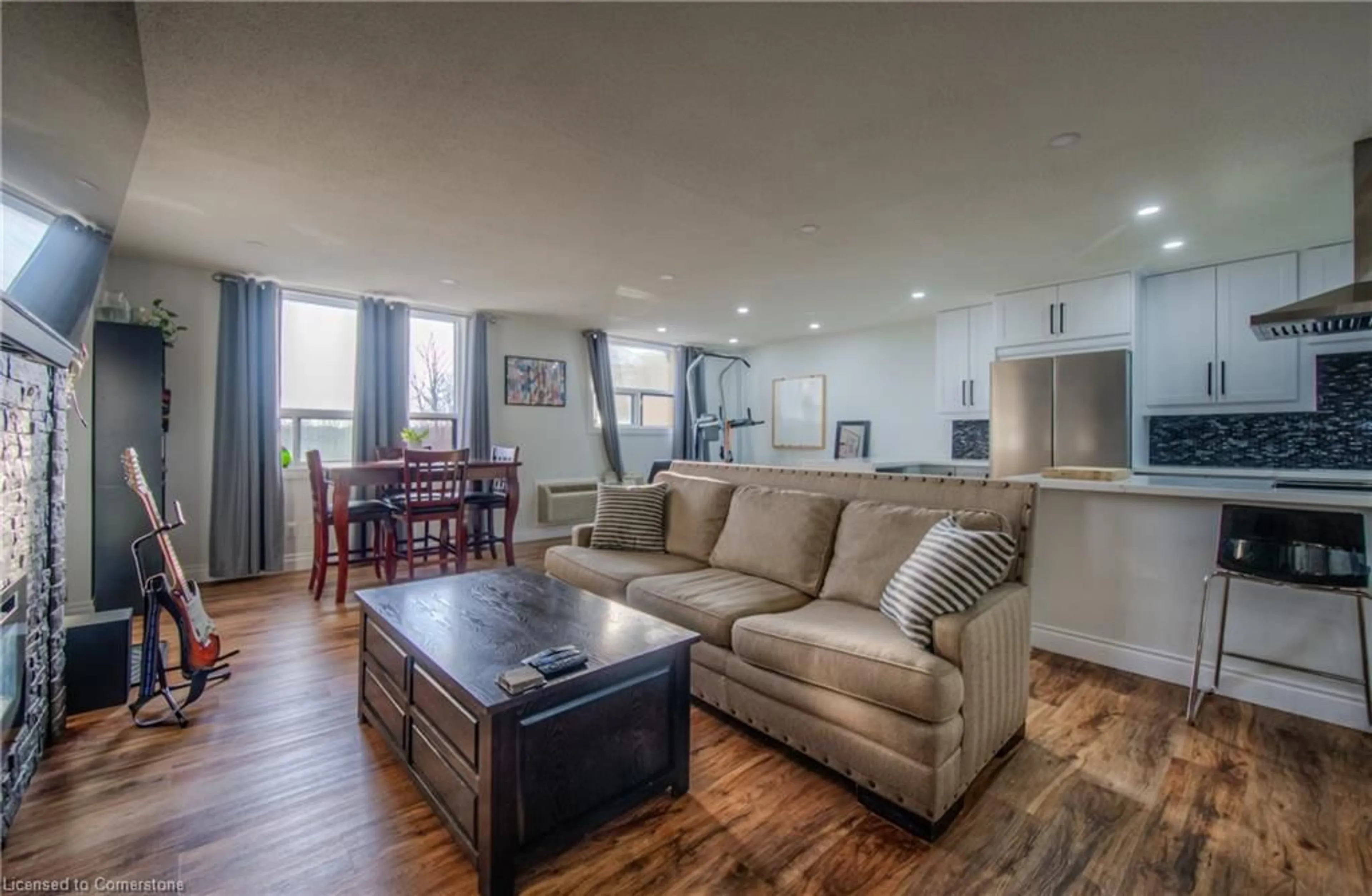 Living room with furniture, wood/laminate floor for 185 Kehl St #410, Kitchener Ontario N2M 5B9