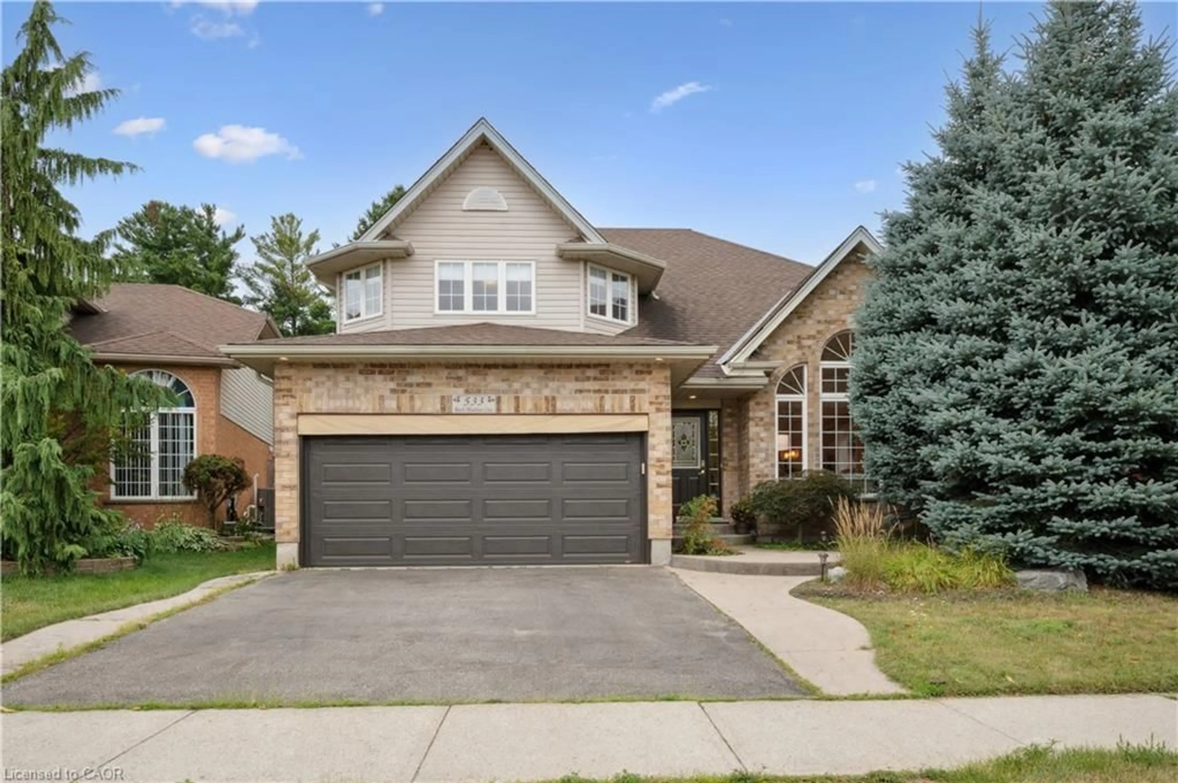 Home with brick exterior material, street for 533 Rush Meadow Cres, Kitchener Ontario N2R 1T2