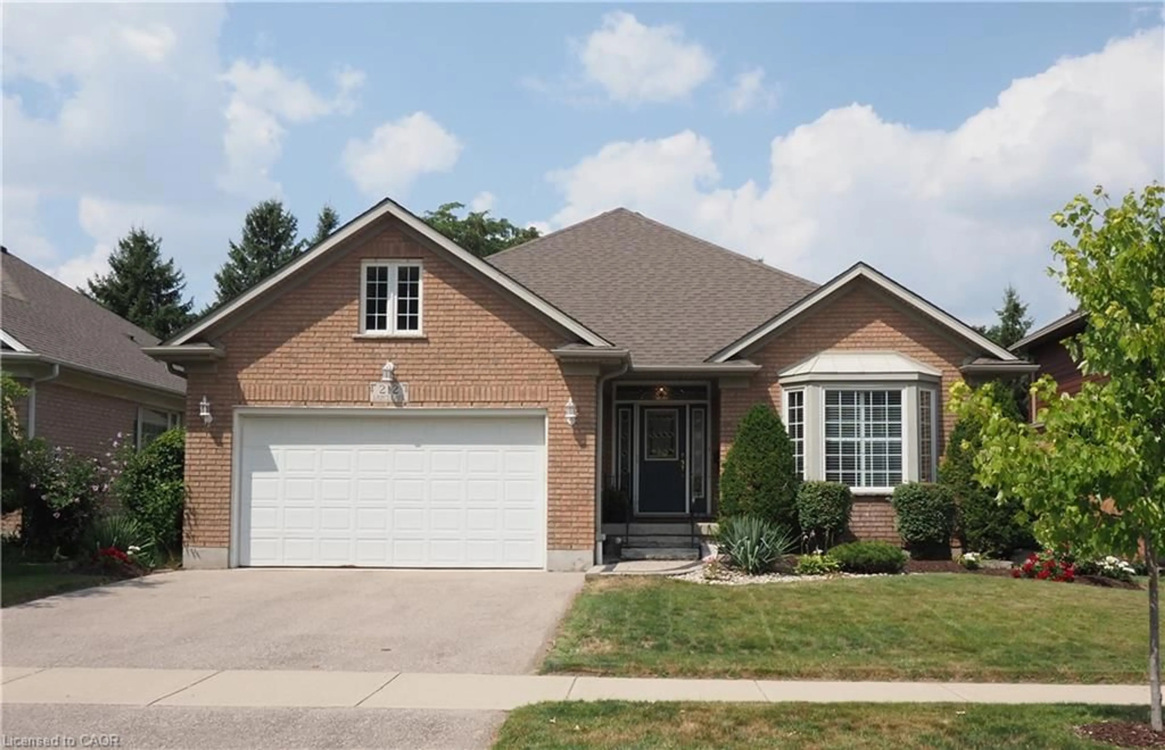 Home with brick exterior material, street for 212 The Lions Gate, Waterloo Ontario N2L 6M5