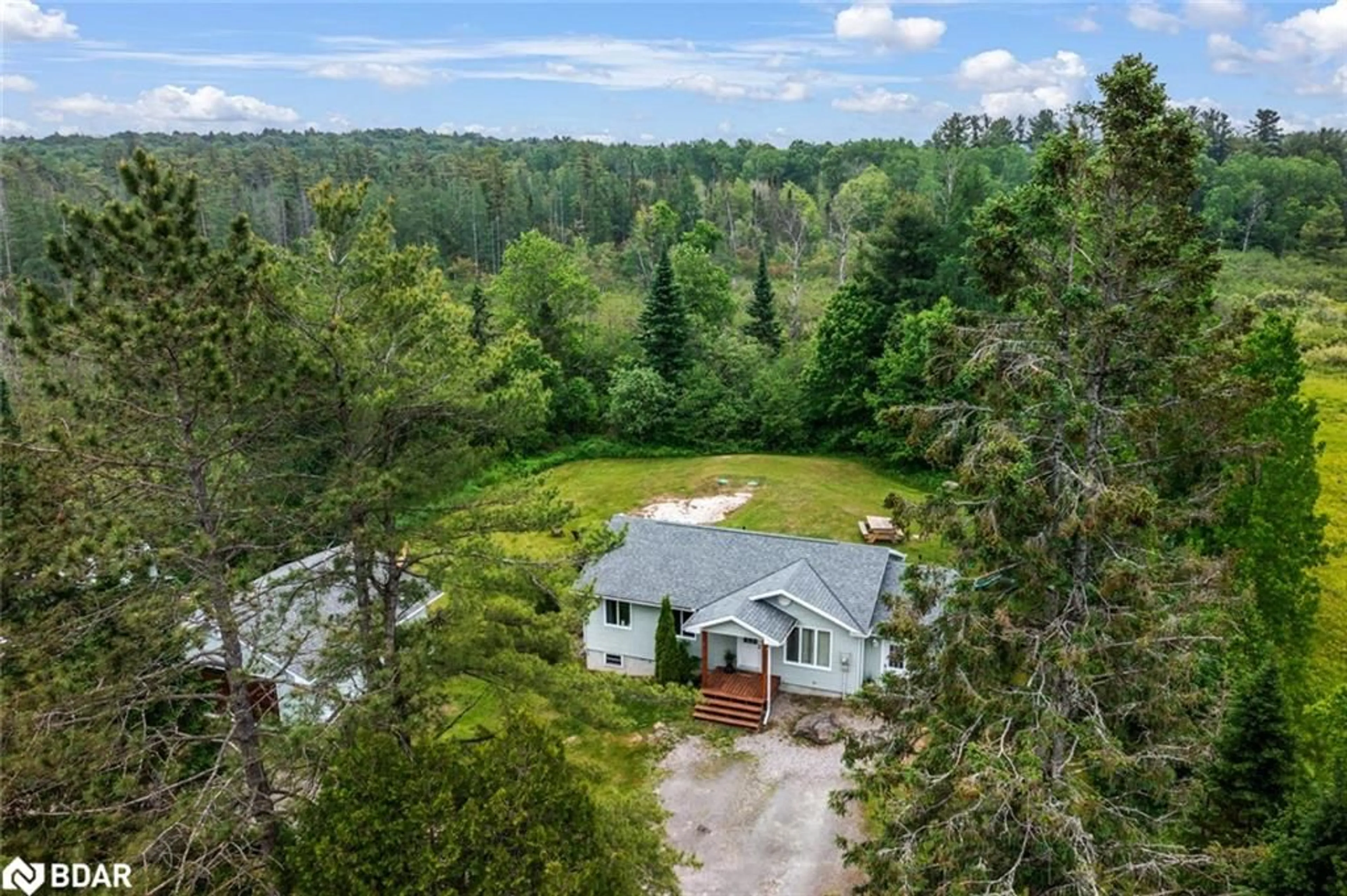 A pic from outside/outdoor area/front of a property/back of a property/a pic from drone, forest/trees view for 115 Mccans Rd, Seguin Ontario P0C 1J0