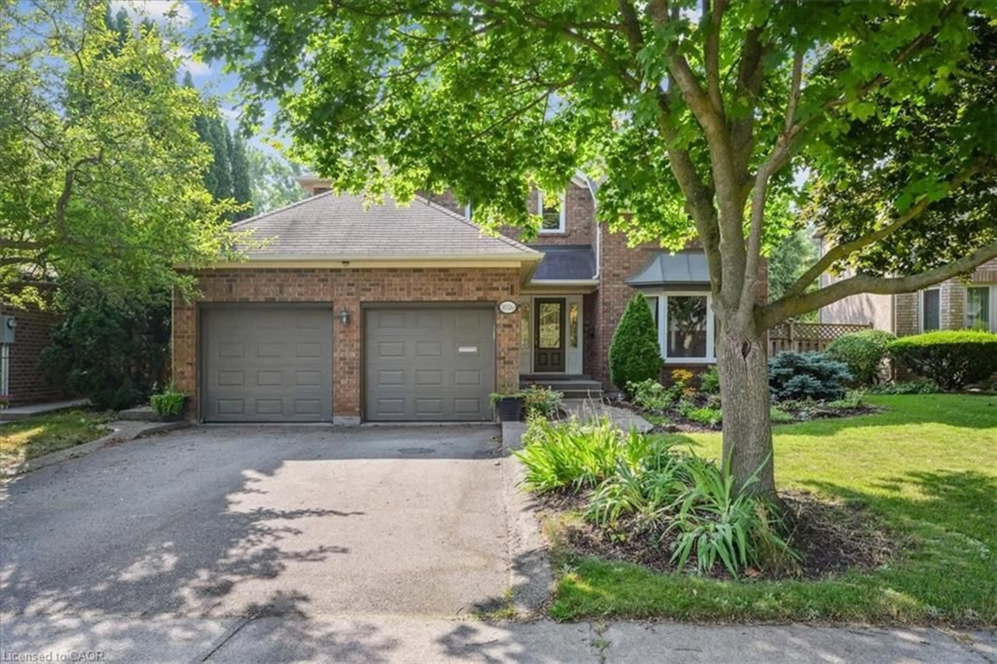 Home with brick exterior material, street for 1026 Oak Meadow Rd, Oakville Ontario L6M 1J7