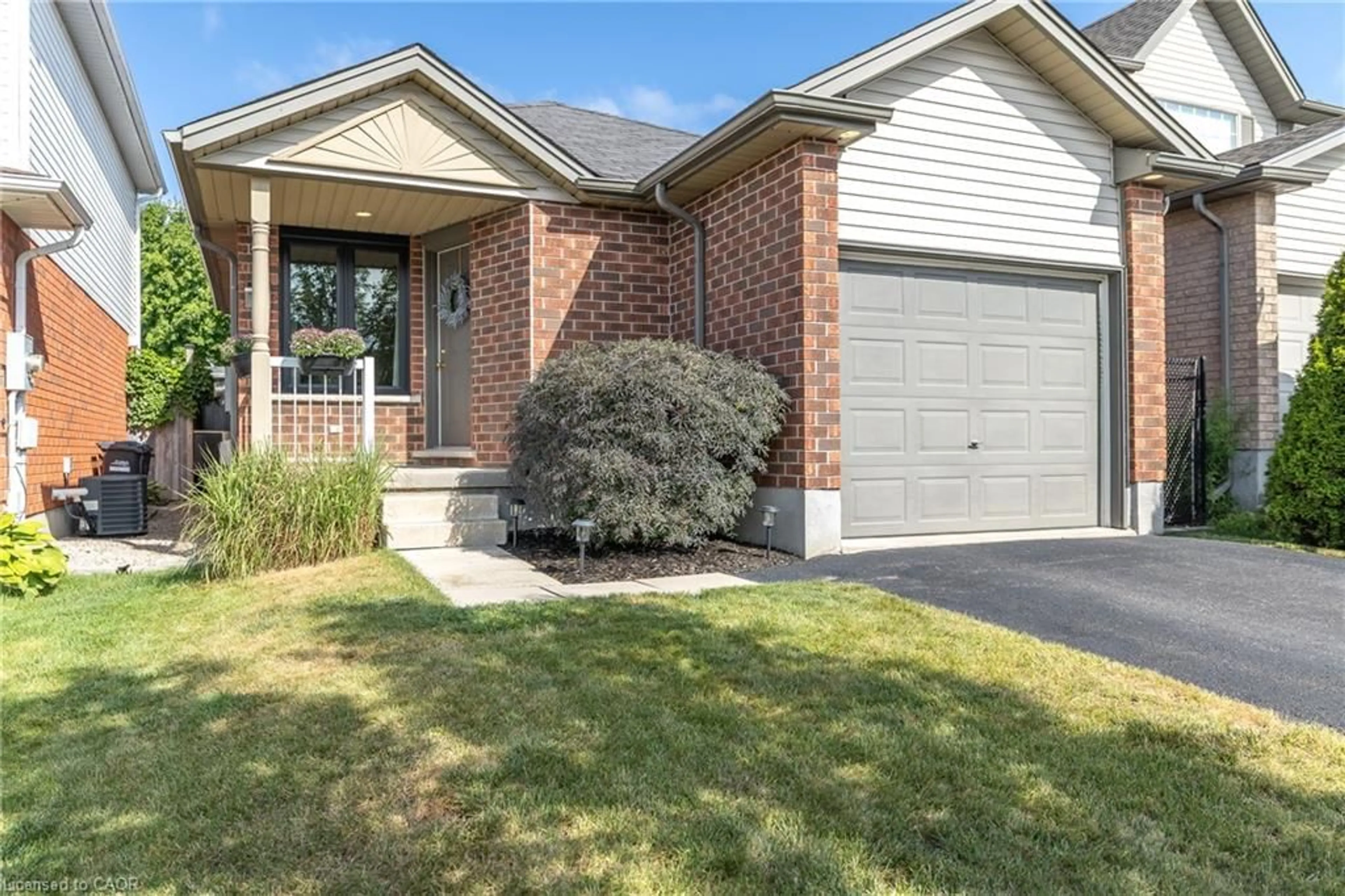 Home with brick exterior material, street for 18 Maude Lane, Guelph Ontario N1E 0E9