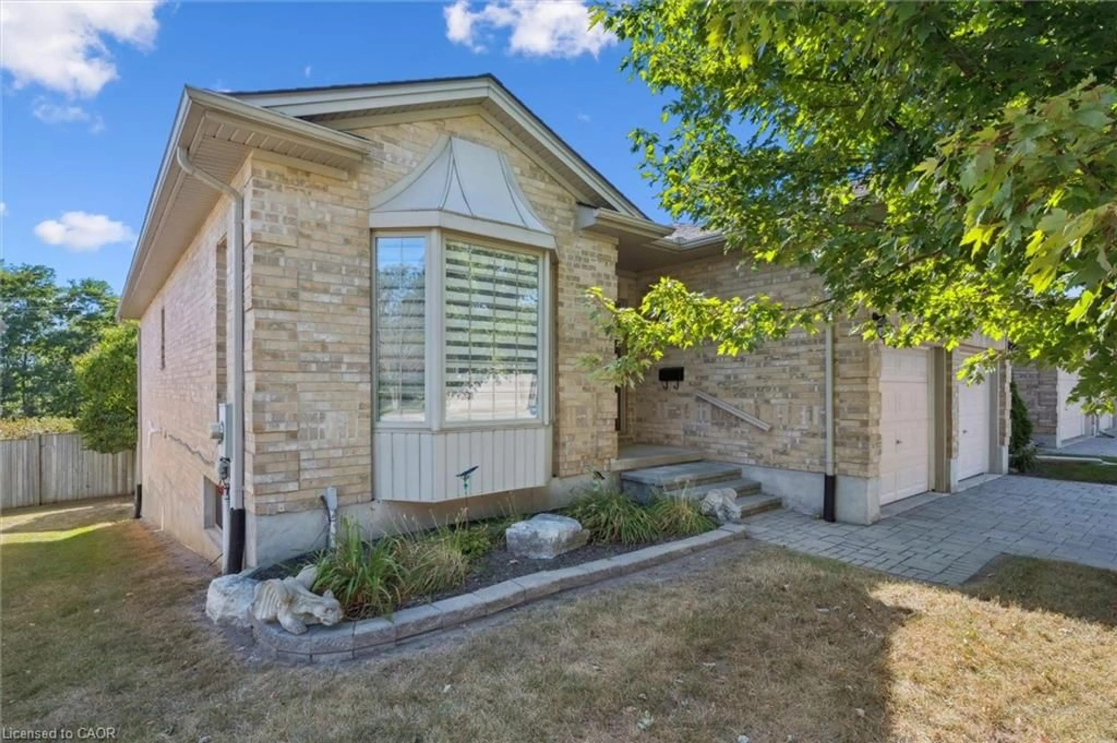 Home with brick exterior material, street for 900 Doon Village Rd #4, Kitchener Ontario N2P 1A4