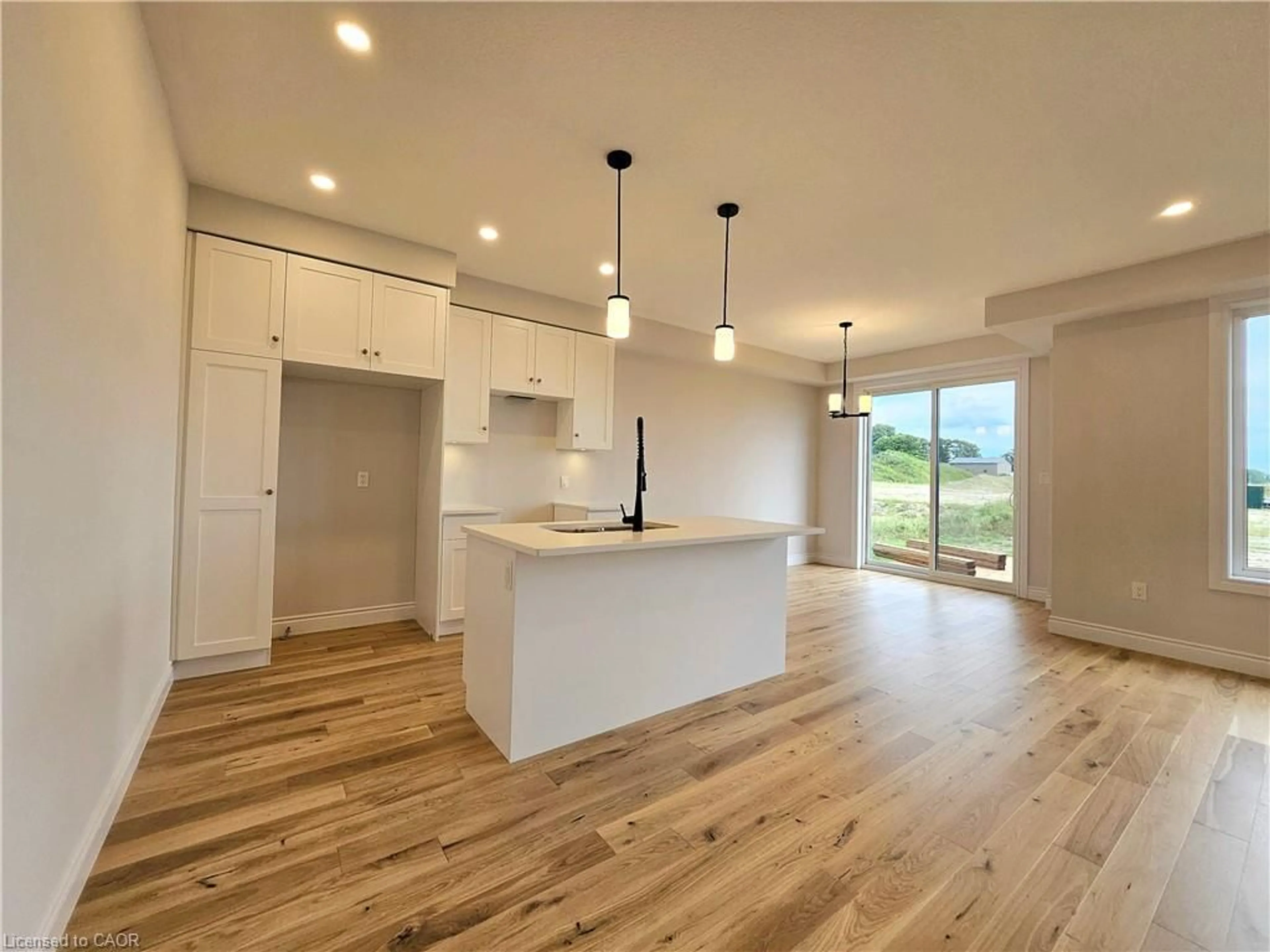 Open concept kitchen, wood/laminate floor for 11 Anne St, Harriston Ontario N0G 1Z0