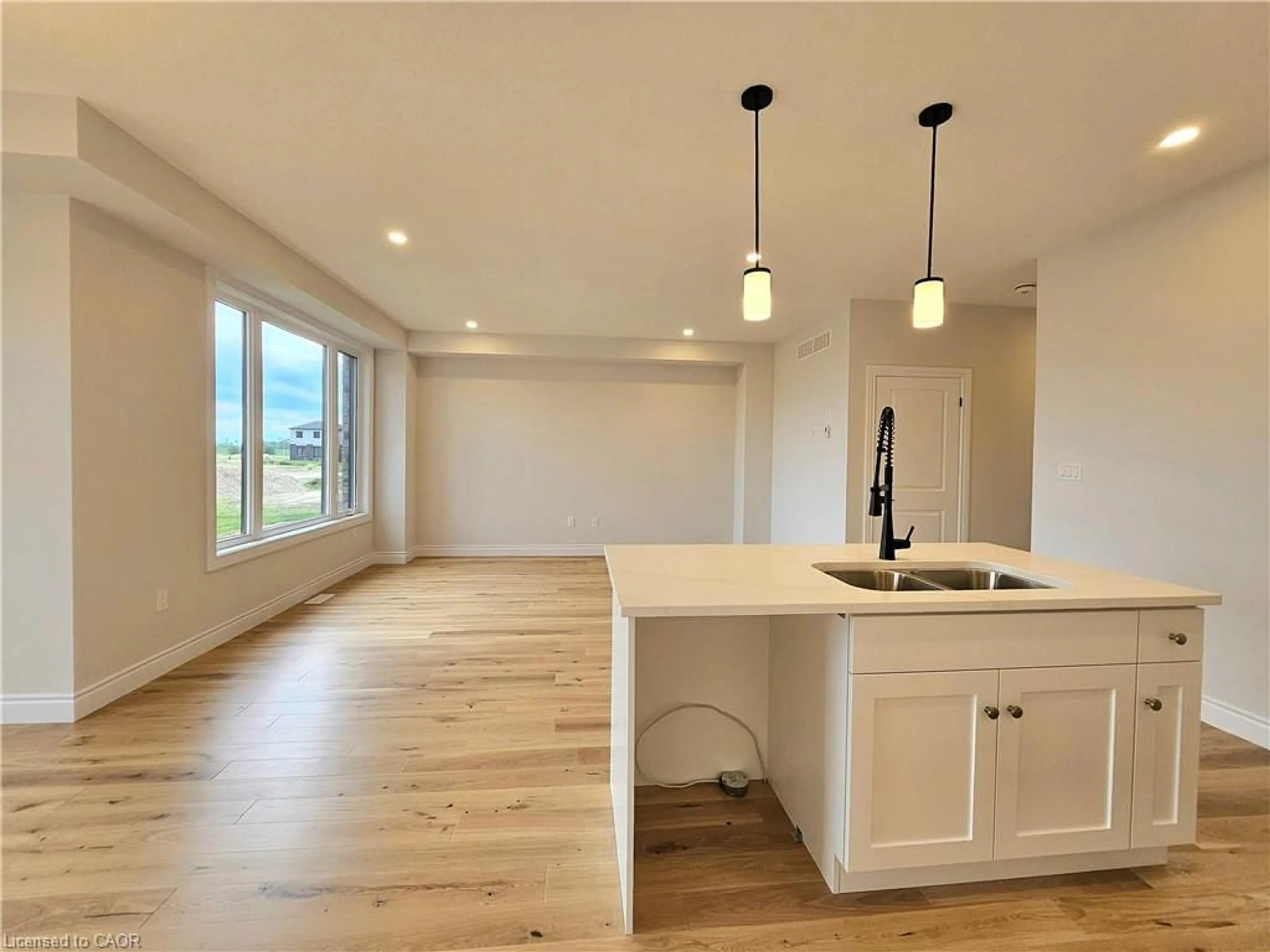 Open concept kitchen, wood/laminate floor for 11 Anne St, Harriston Ontario N0G 1Z0