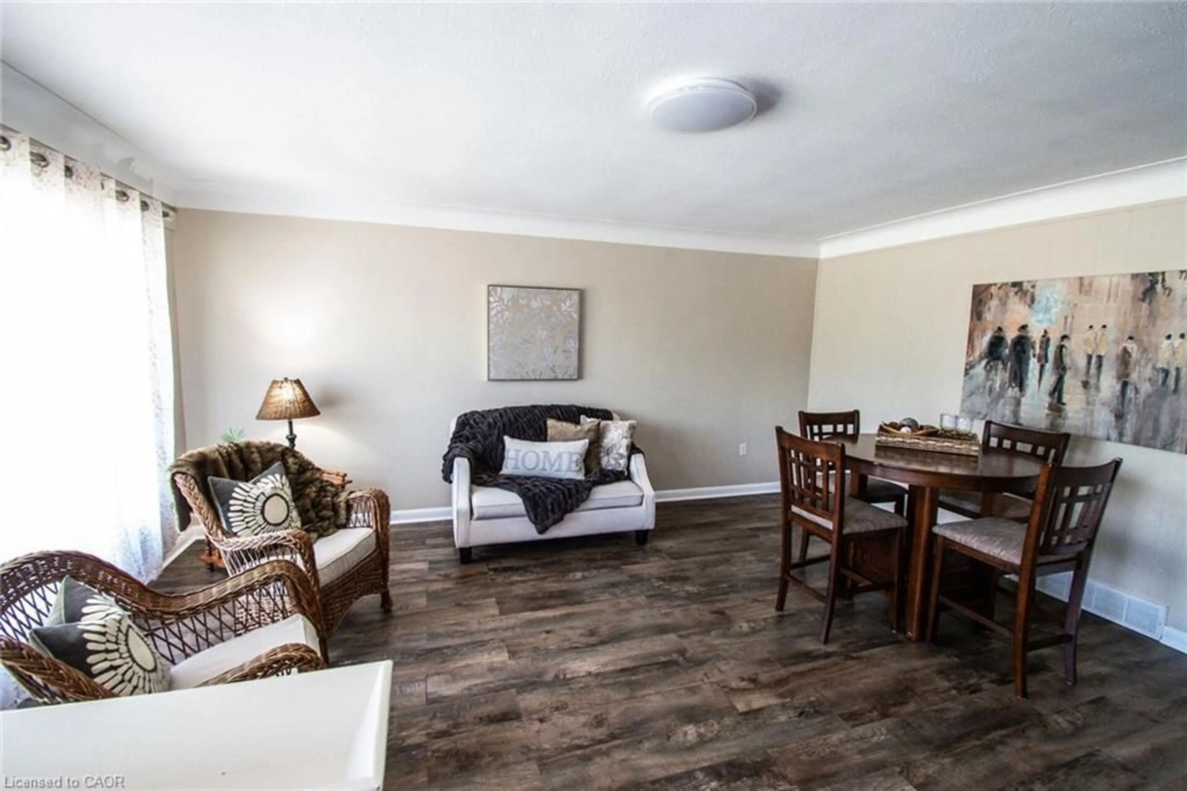 Living room with furniture, wood/laminate floor for 482 Stanley St, Port Colborne Ontario L3K 3A6
